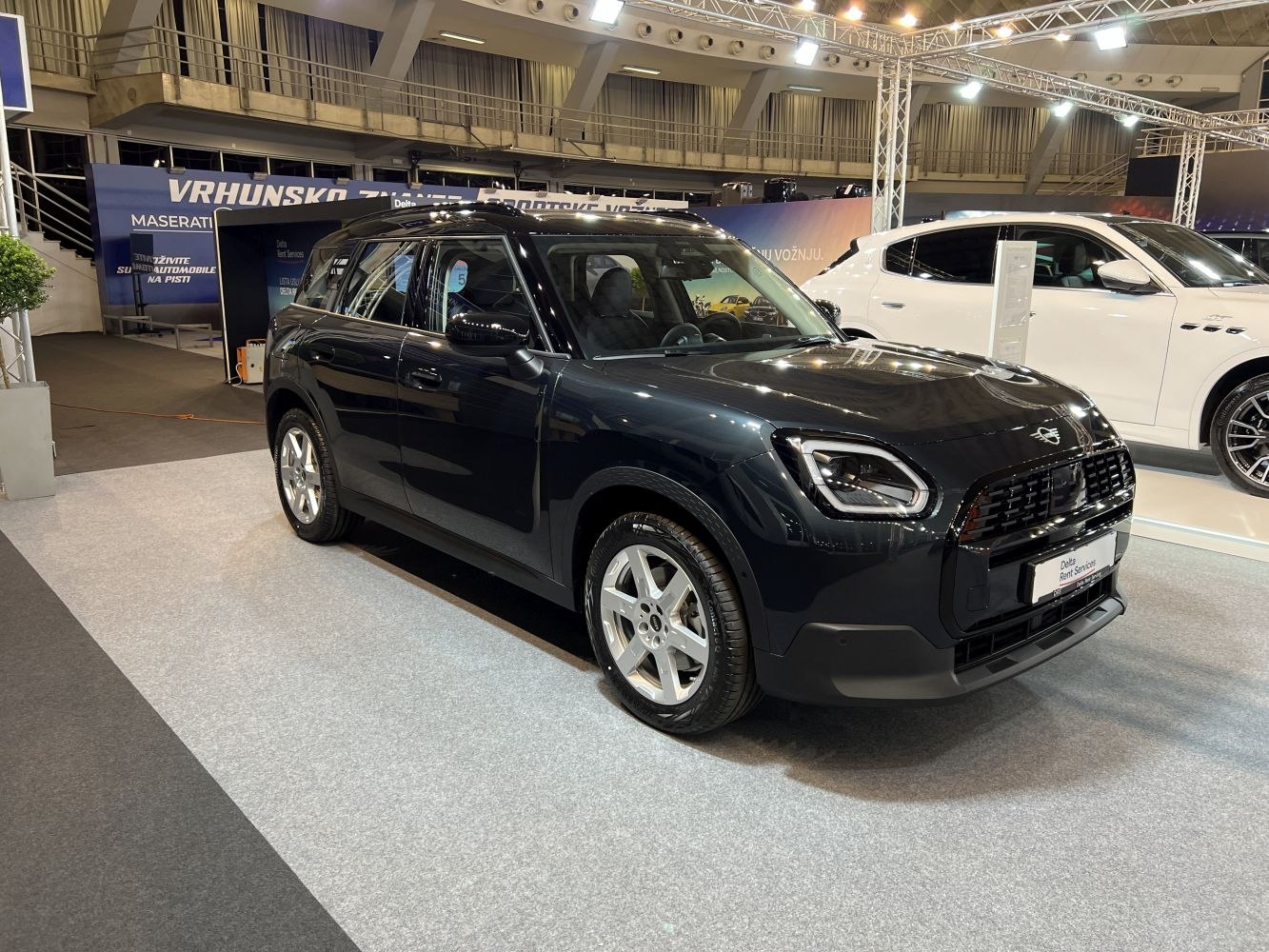 Front angle view with distinctive headlights and bold grille.