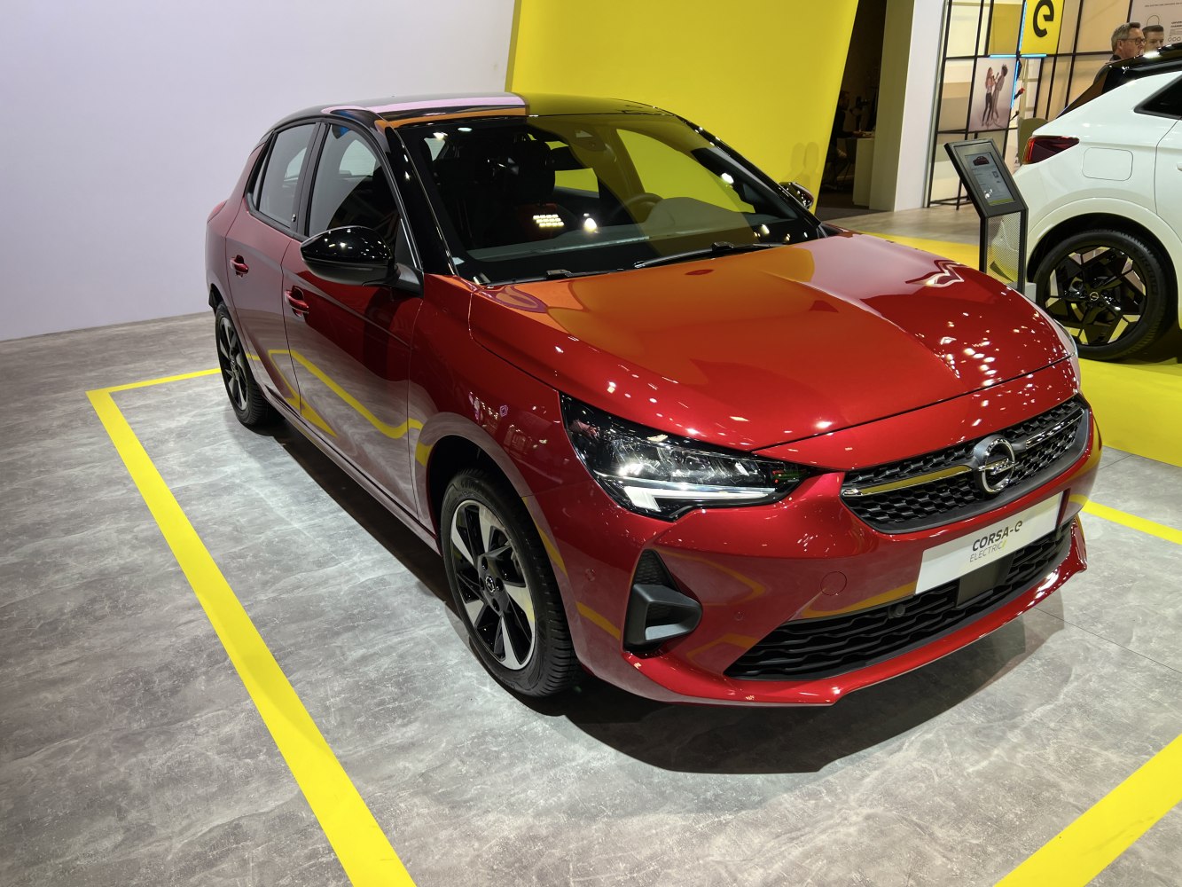 Red electric hatchback with LED headlights, sporty wheels