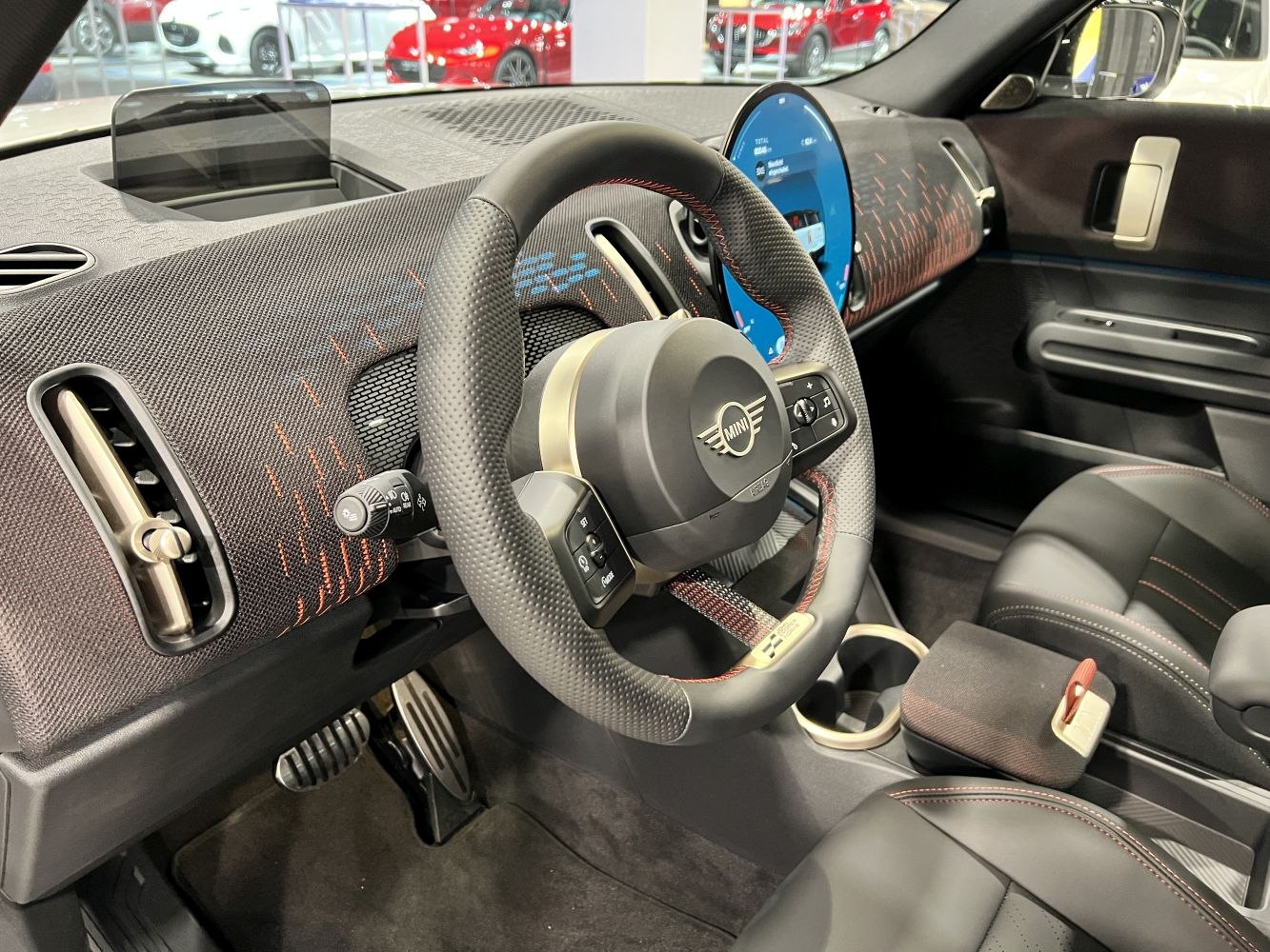 Dashboard with digital display and multifunction steering wheel in modern car interior