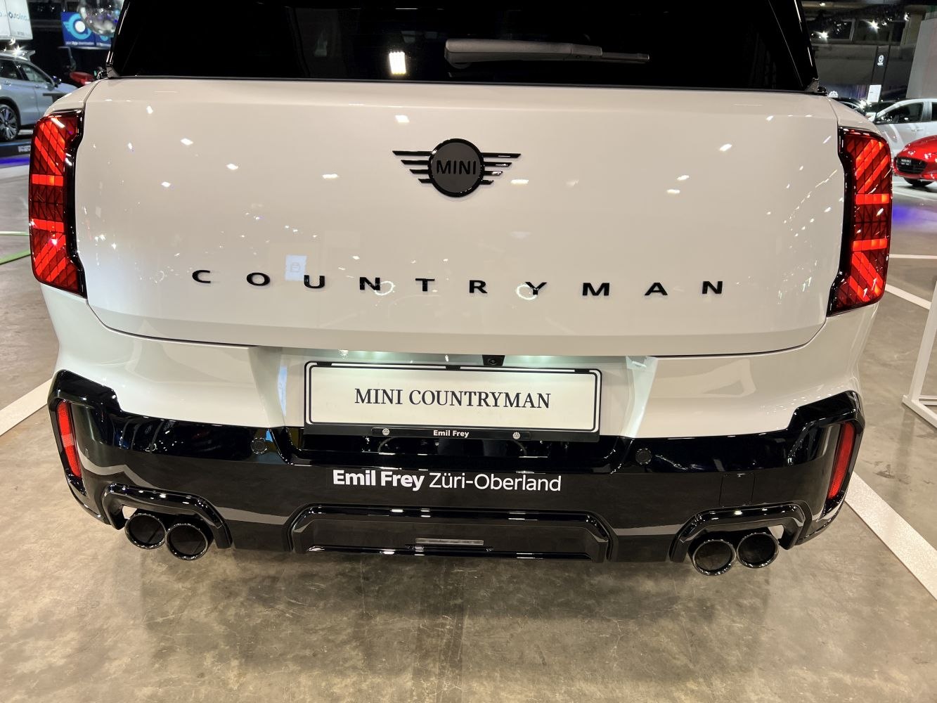 Rear view of a compact SUV with quad exhaust and distinct taillights