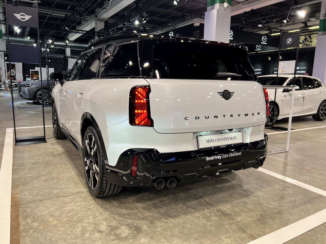 Rear view with distinctive taillights and dual exhaust pipes