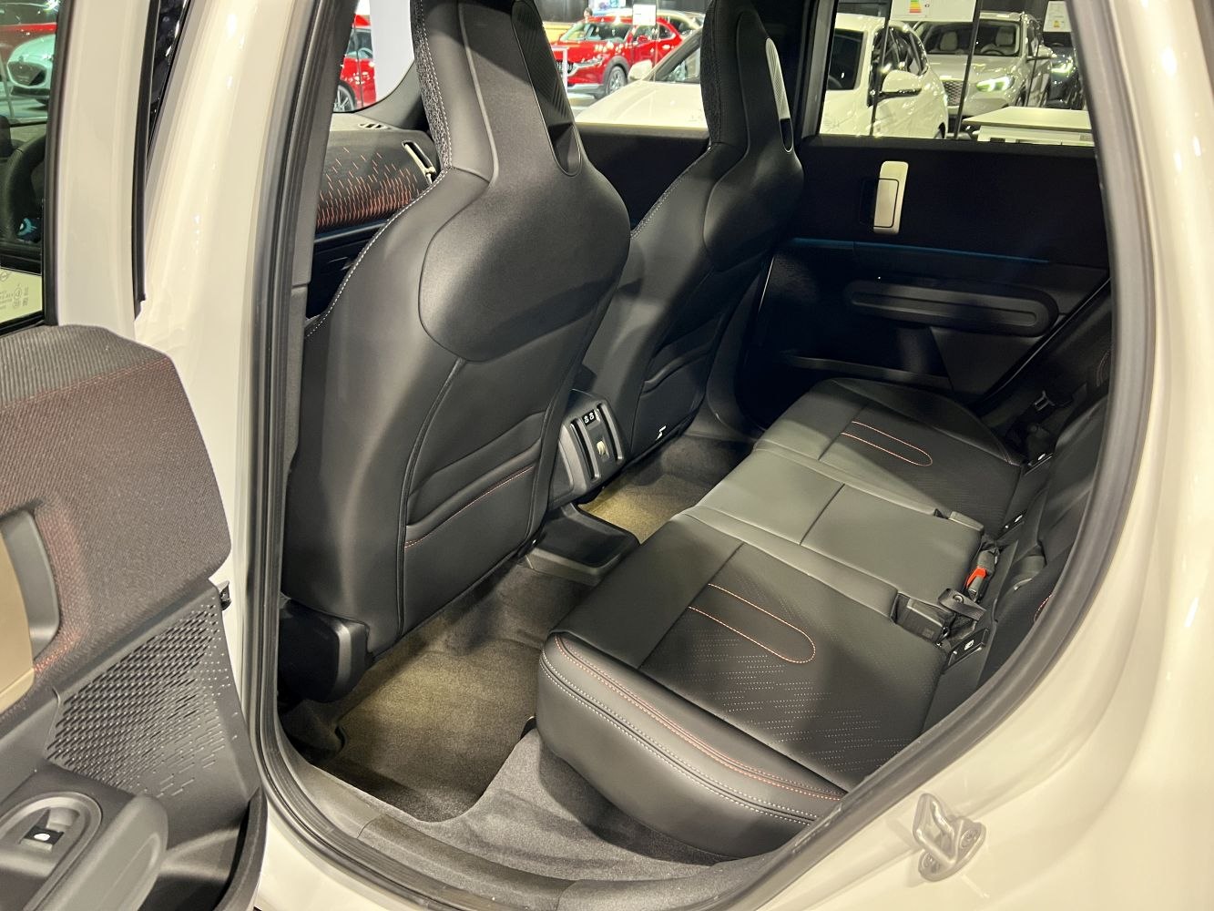 Rear seat interior with black leather and contrast stitching