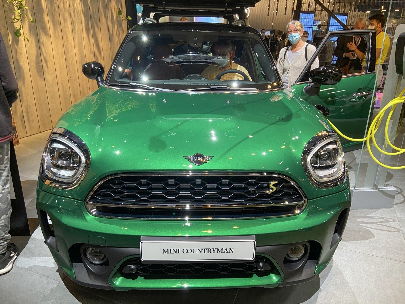 Front grille and headlights of a green Mini Countryman F60 facelift 2020.