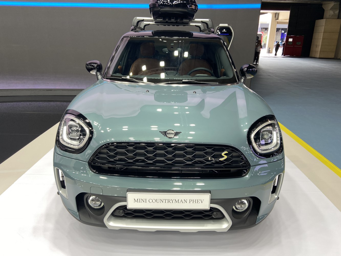 Front view of compact SUV with LED headlights and PHEV badge on grille