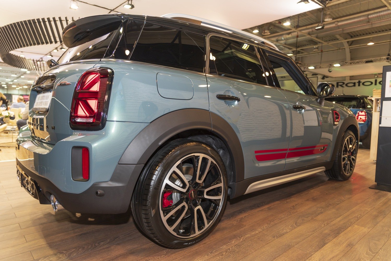 Rear and side view with distinct taillights and alloy wheels