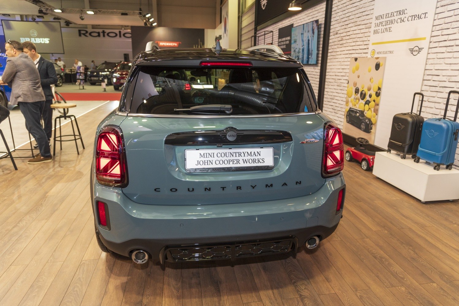 Rear view with unique taillights and dual exhaust pipes