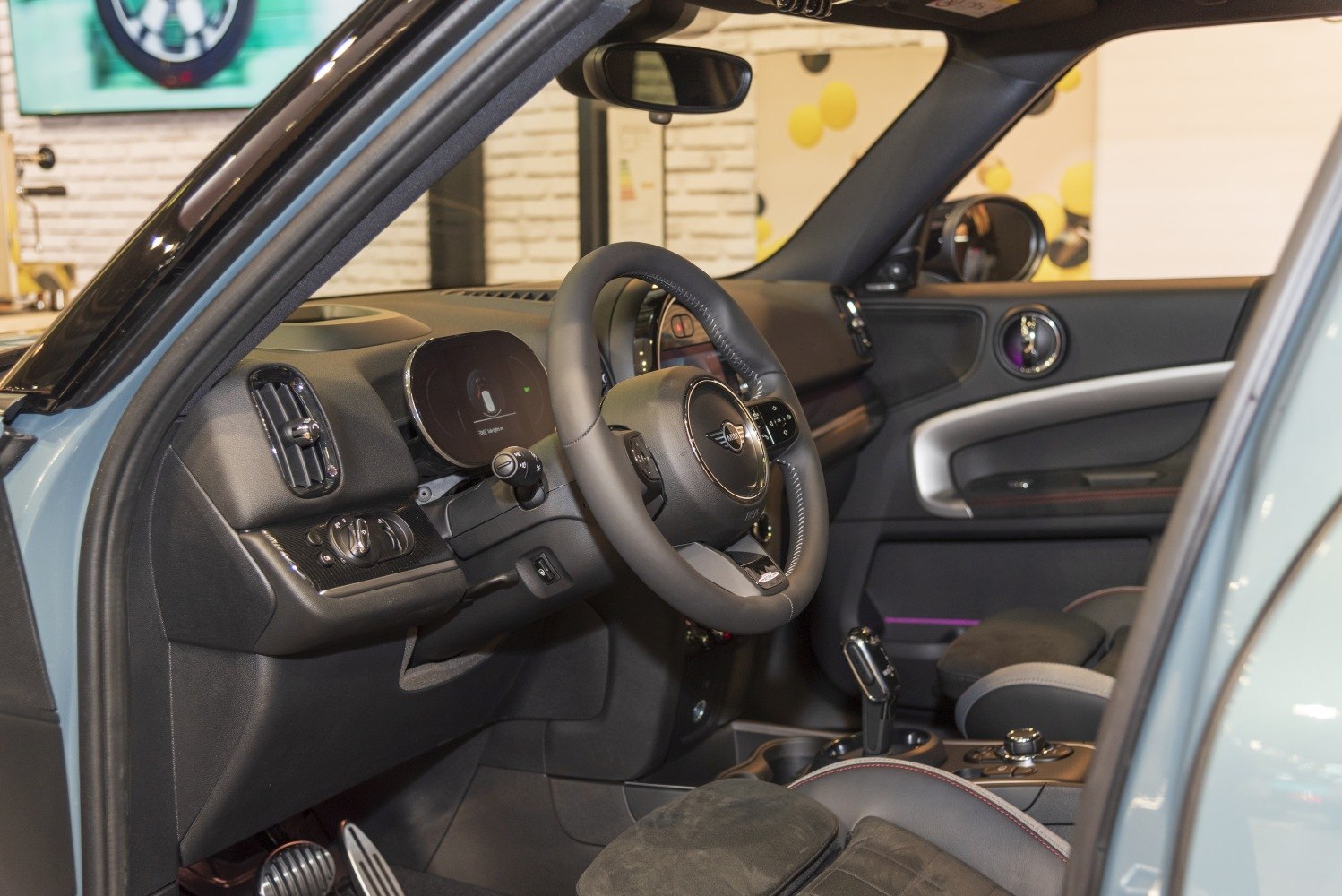 Modern car interior with dashboard and multifunction steering wheel