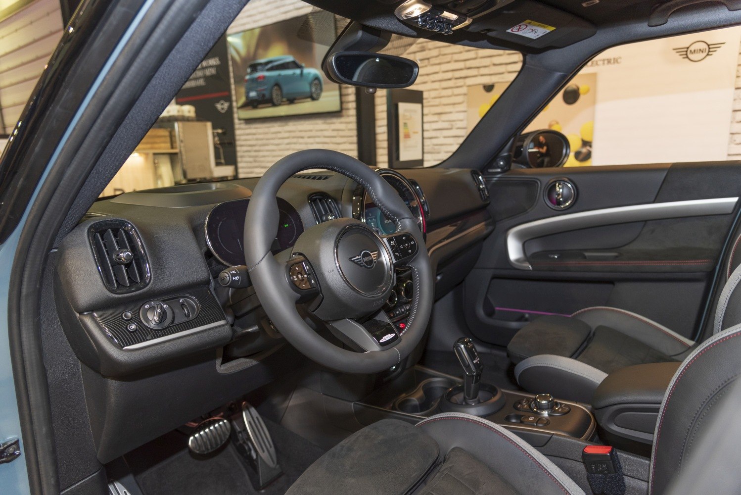 Modern dashboard and steering wheel with center console and gear selector