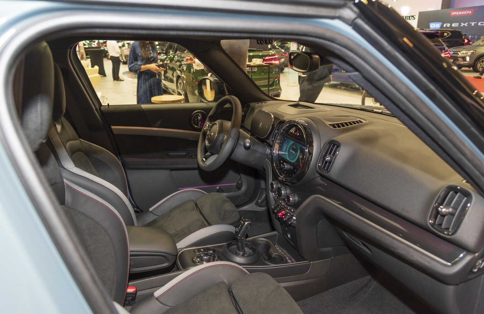 Front interior cabin with dashboard and seats.