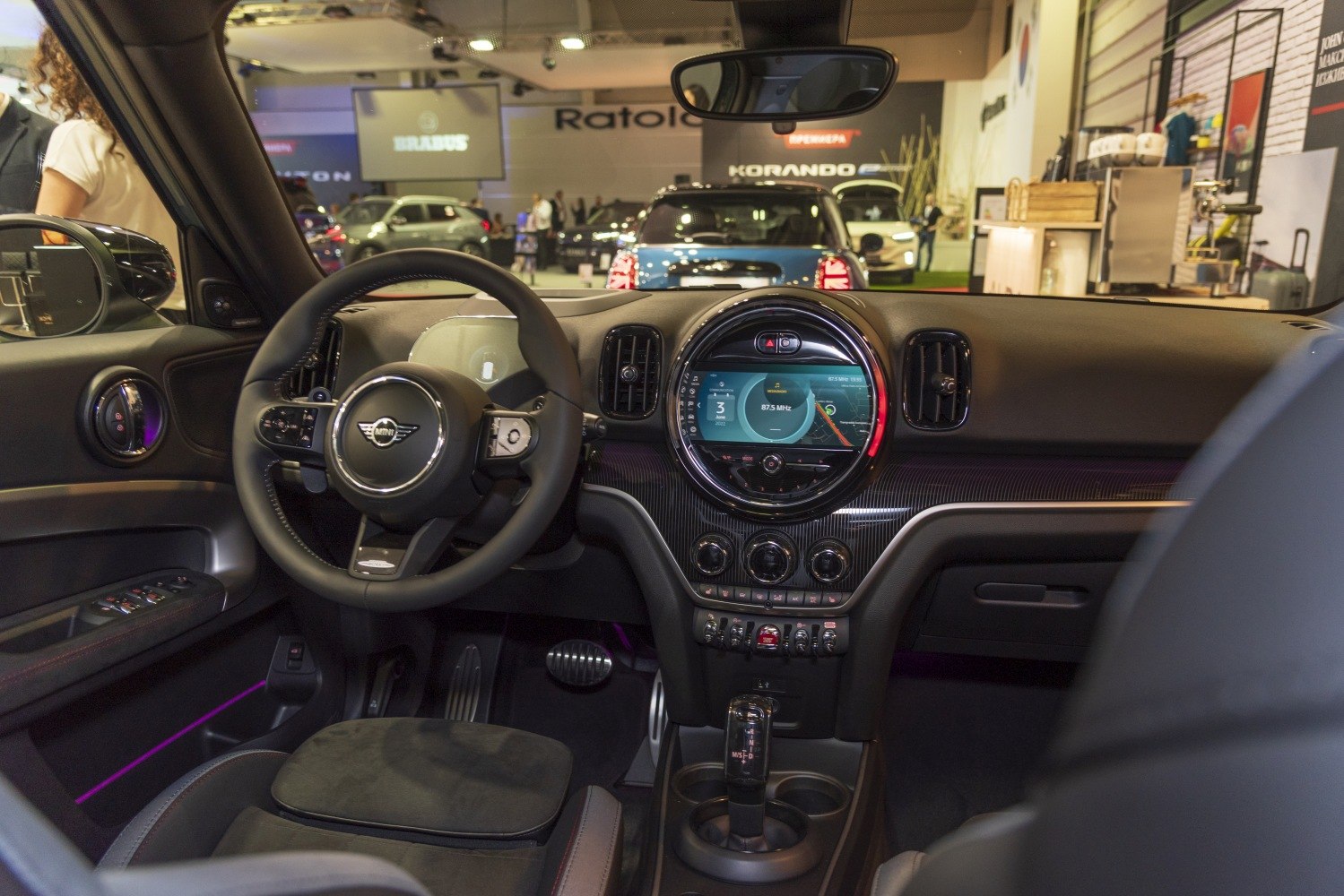 Modern interior with circular infotainment display and multifunction steering wheel