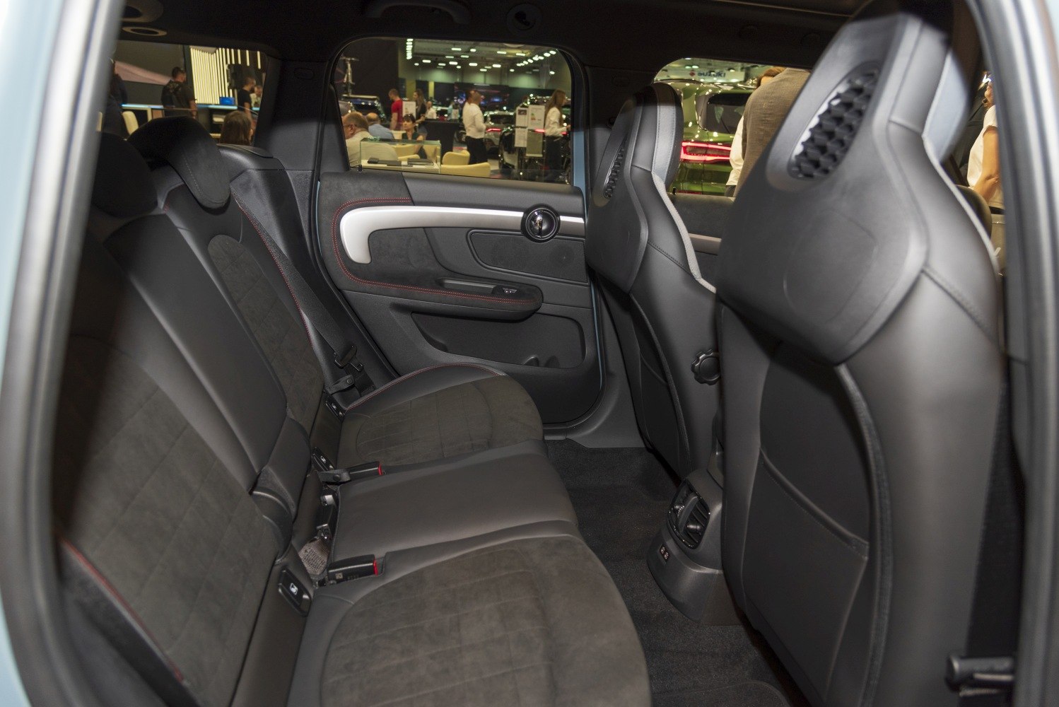 Rear seating area with premium upholstery and door panel.