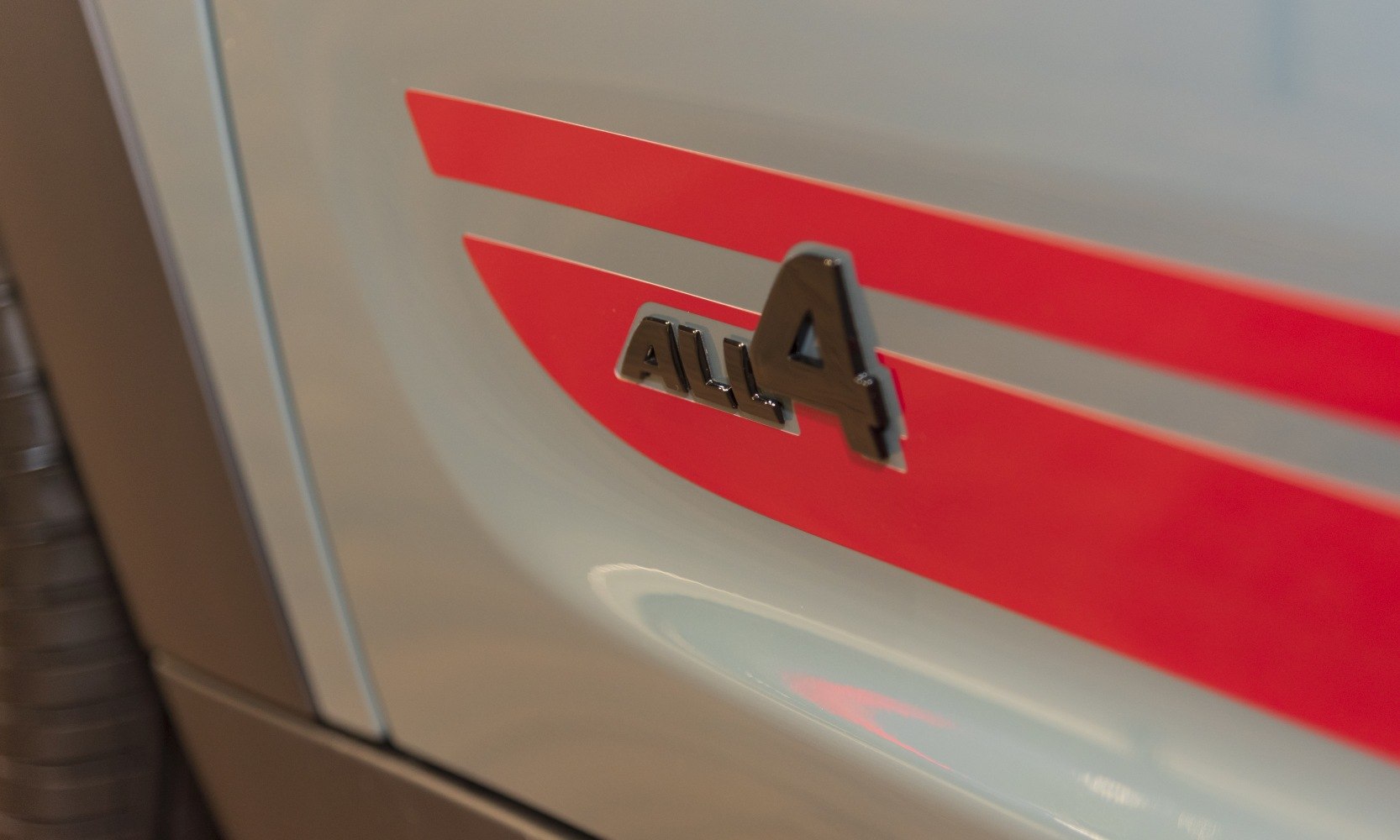 Close-up of All4 badge with red stripe on car side panel