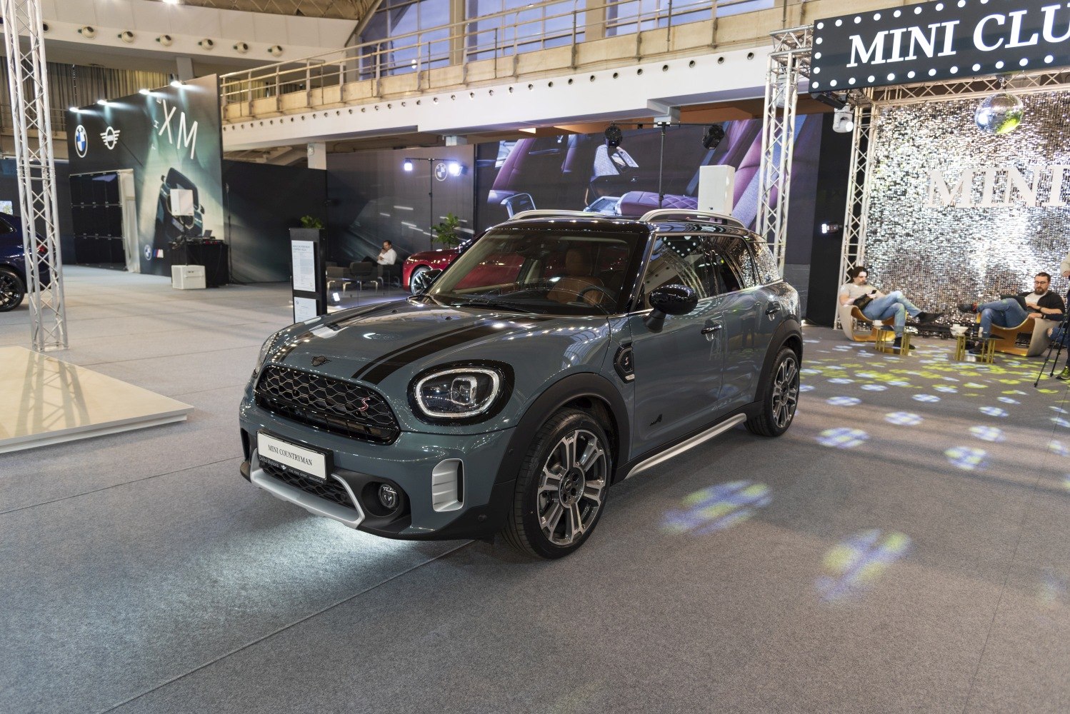 Front three-quarter view of a modern compact SUV with distinctive headlights and stylish wheels