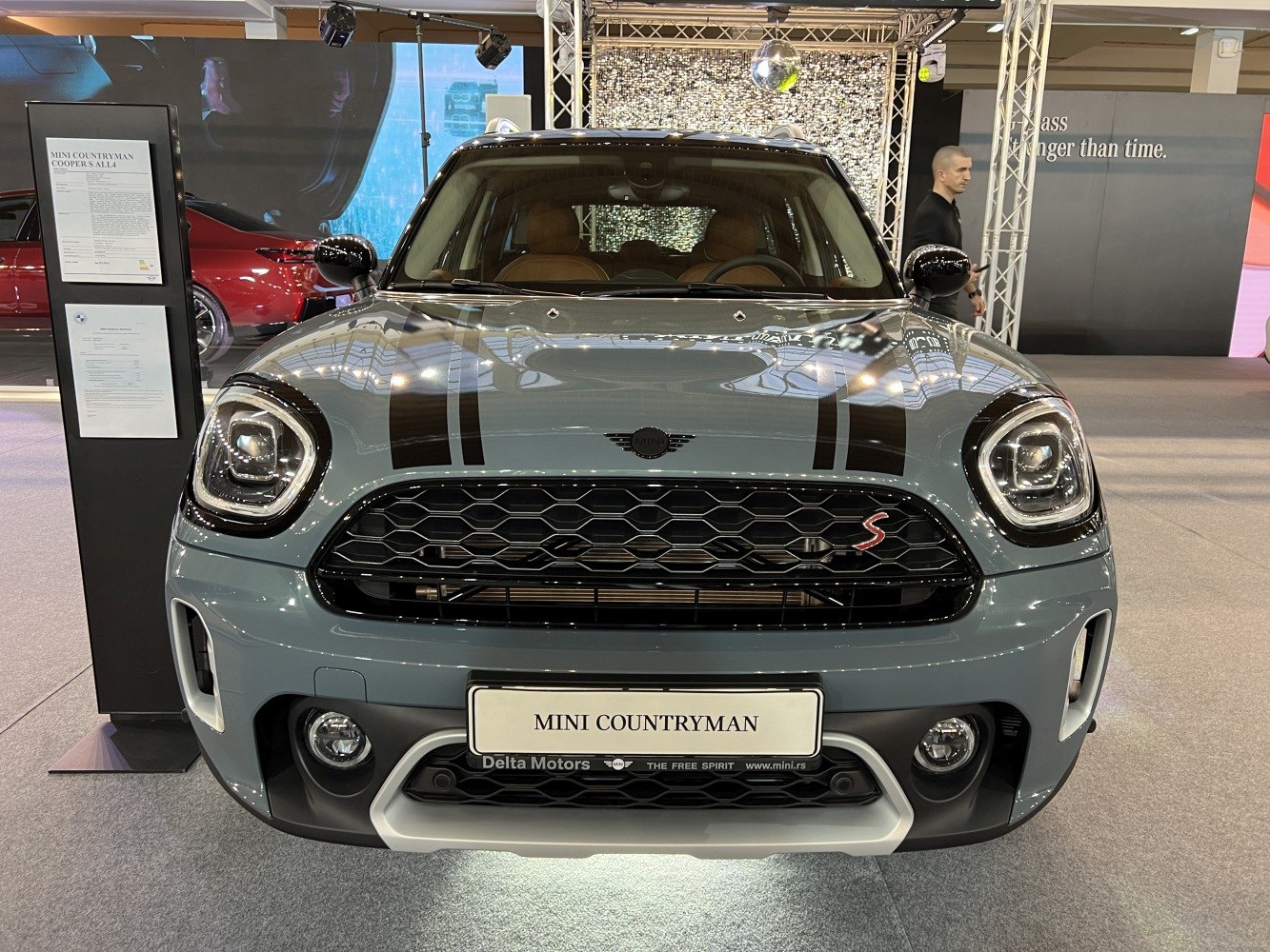 Front view with black grille and racing stripes on compact SUV