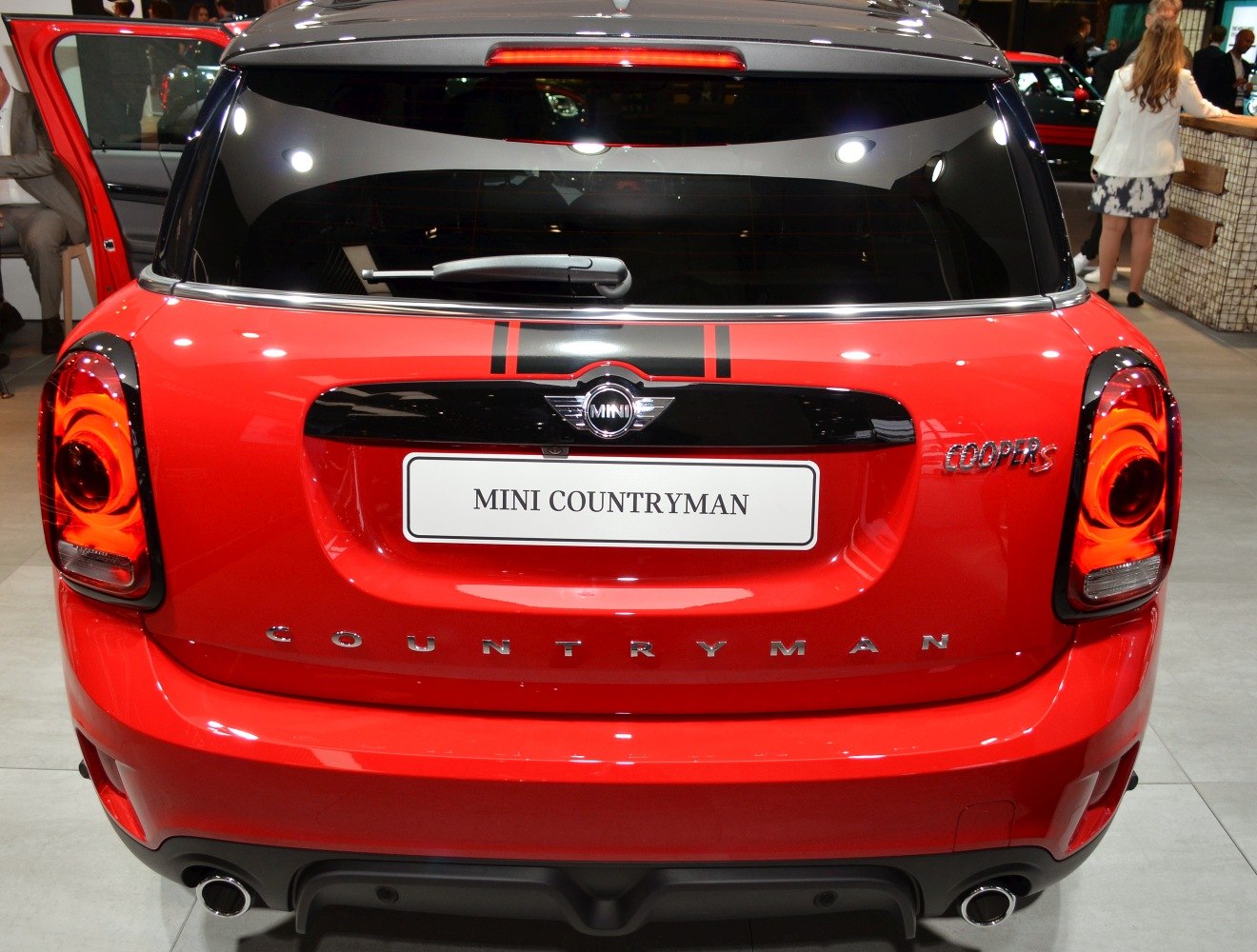 Red rear hatch with dual exhausts, black trim, and Cooper S badge