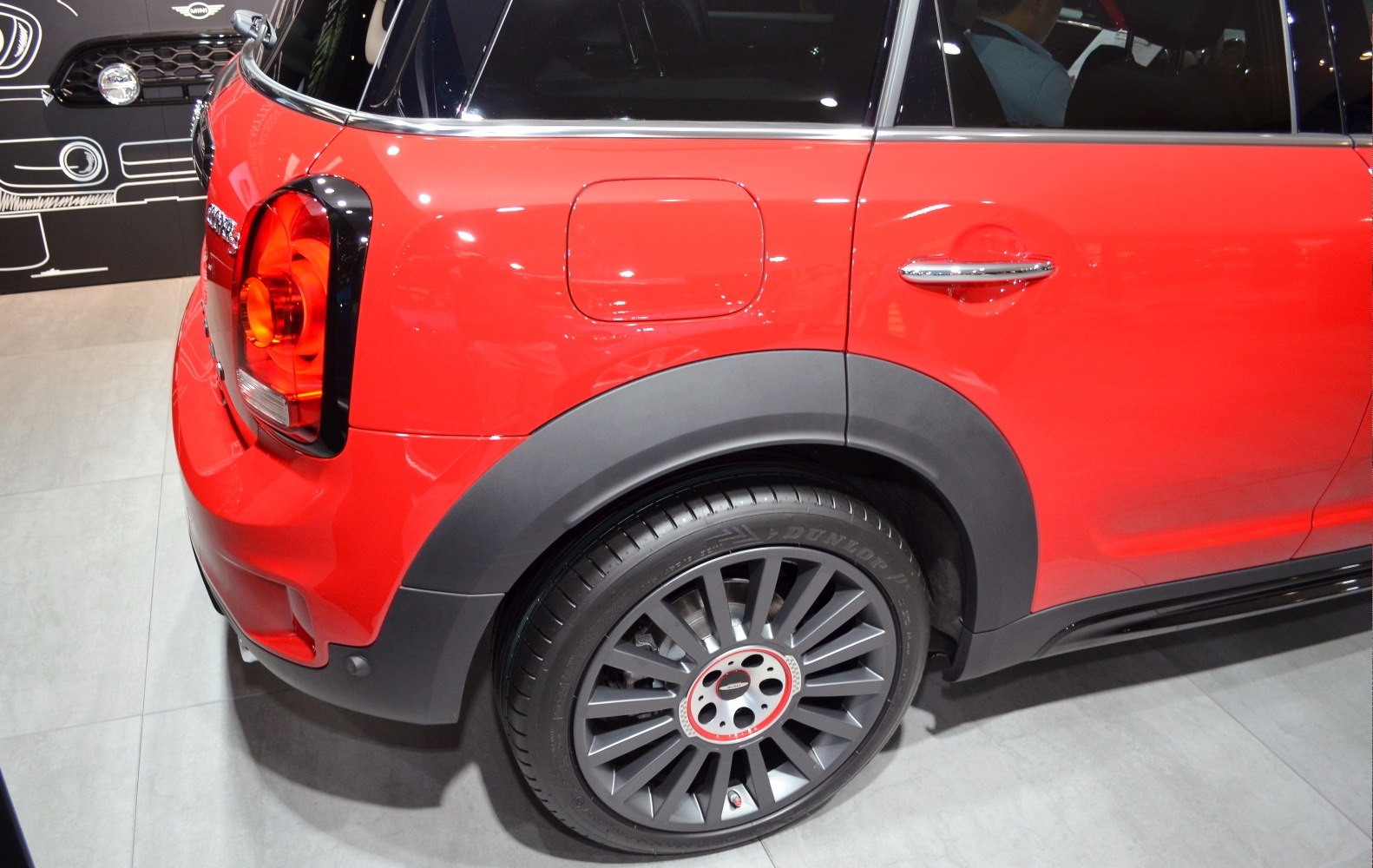 Rear side with distinctive taillight, fuel cap, and alloy wheel.
