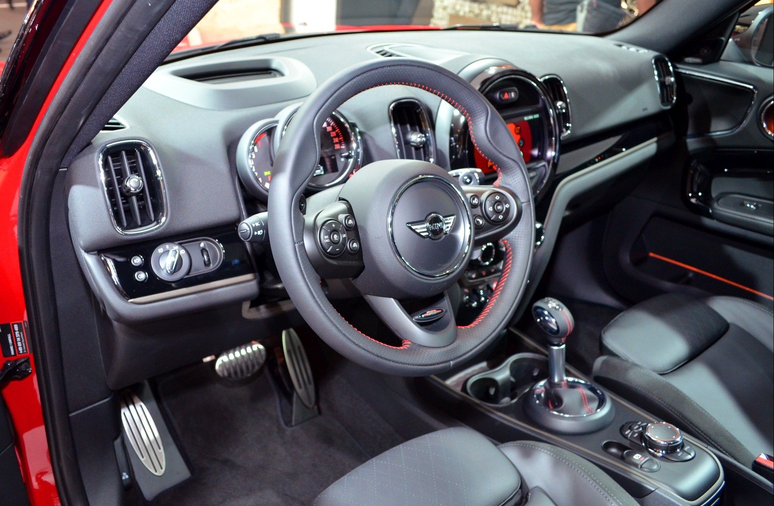 Leather steering wheel and gearshift in modern car interior