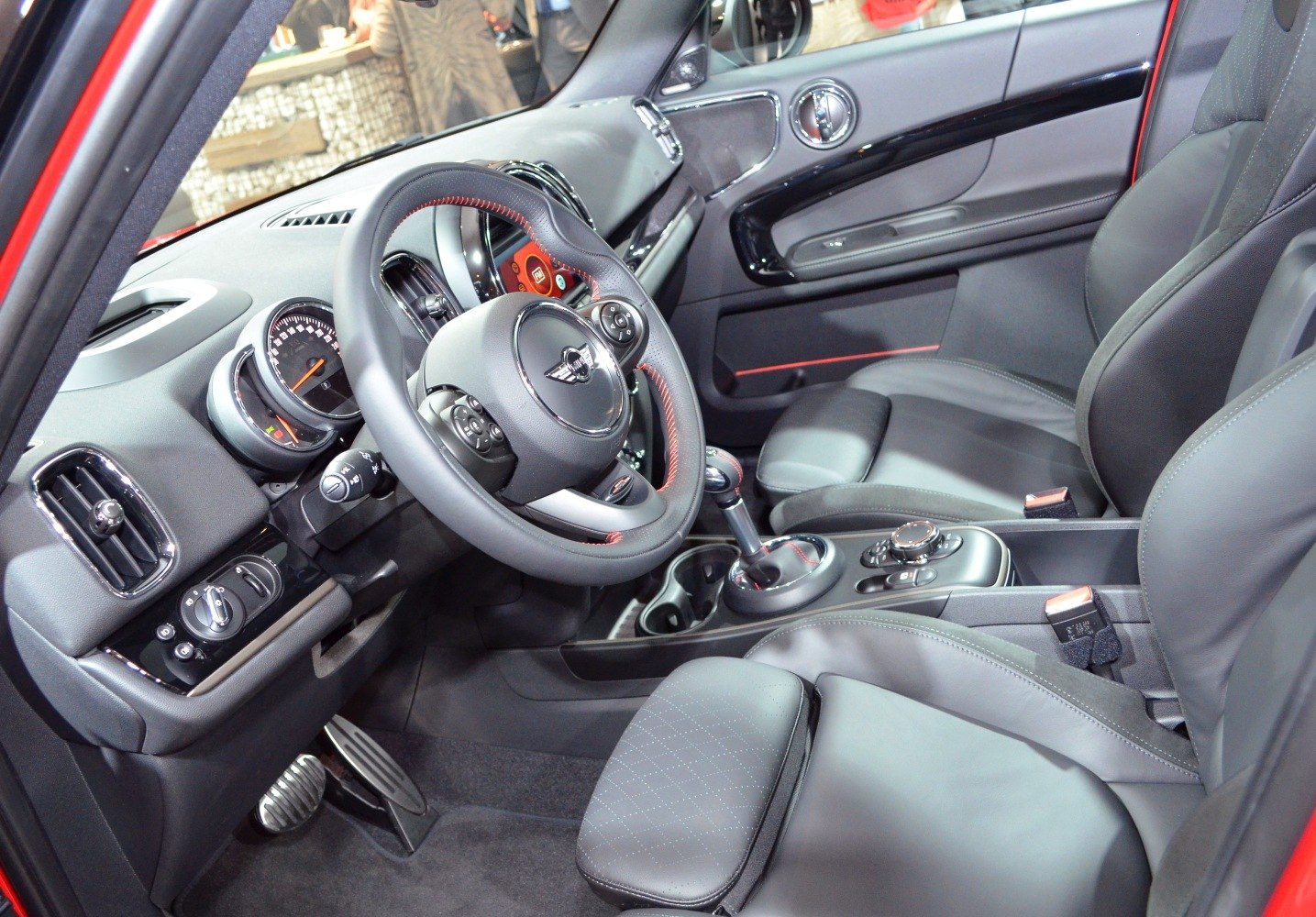 Modern car interior with leather seats and advanced dashboard.