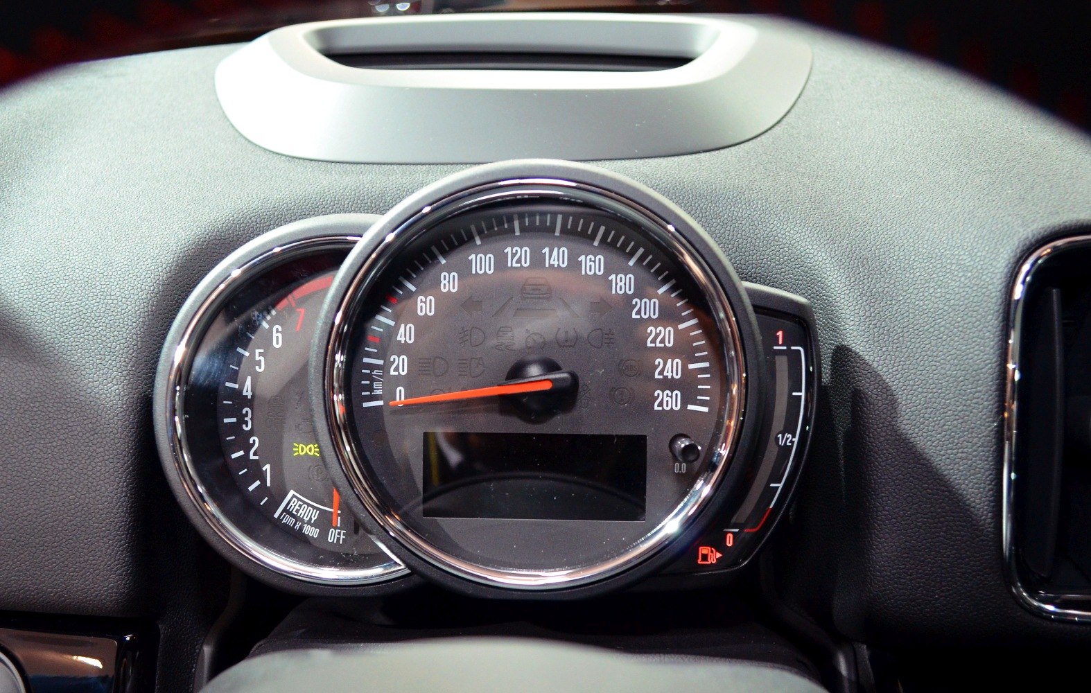 Speedometer, tachometer and fuel gauge on car dashboard