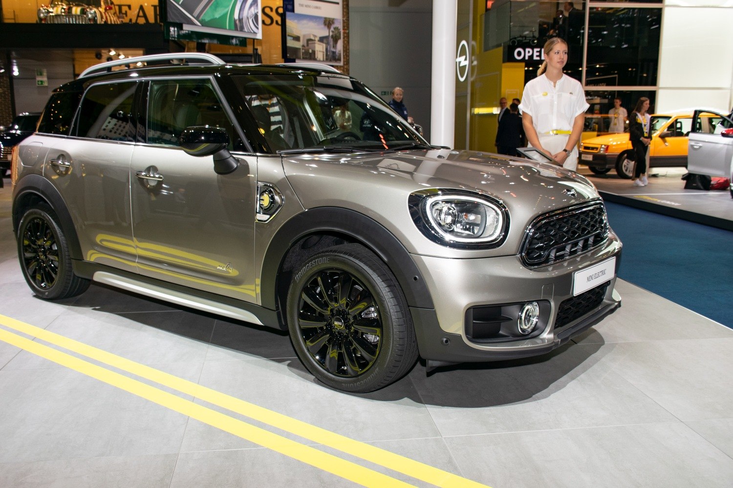 Front-side profile of compact SUV with black alloy wheels and sleek headlights