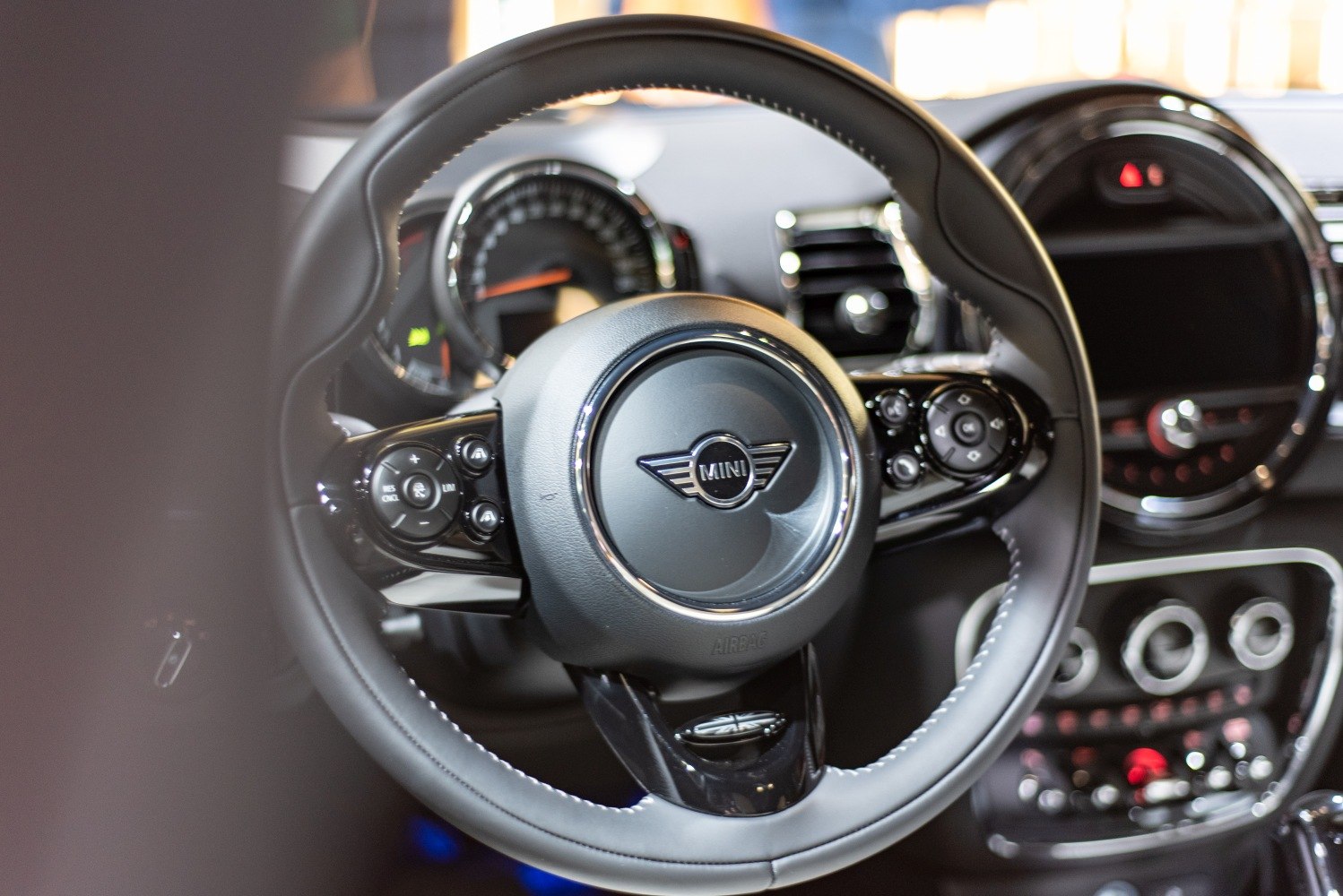 Steering wheel and dashboard close-up of car interior