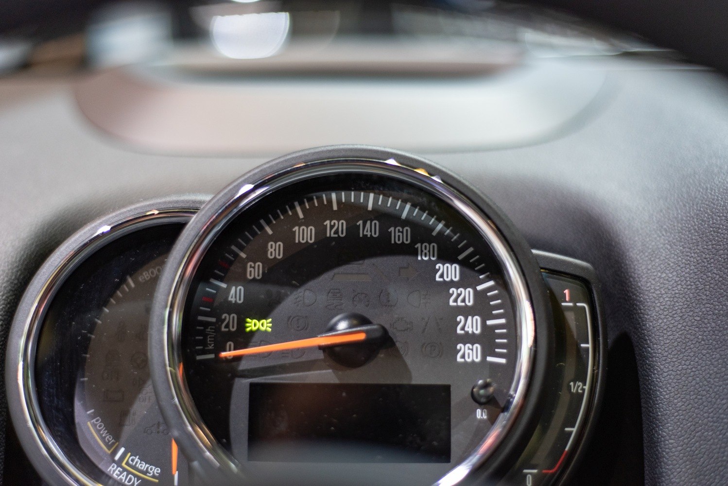 Speedometer and fuel gauge cluster with dashboard indicator lights