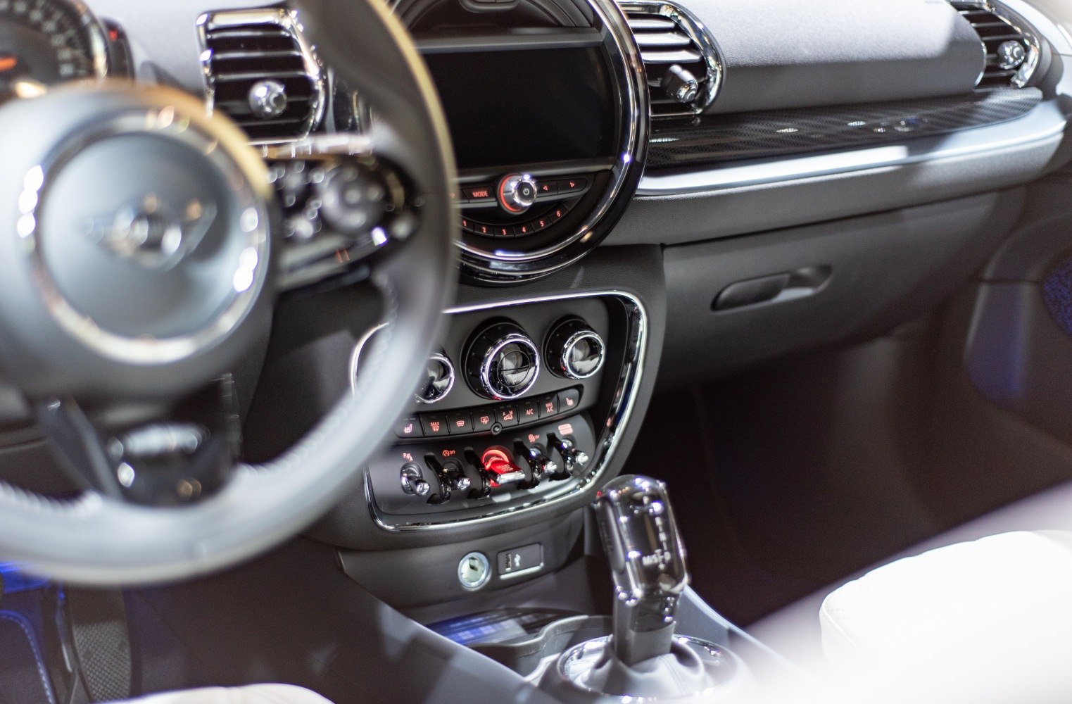 Car interior dashboard, center console, and gear shift close-up