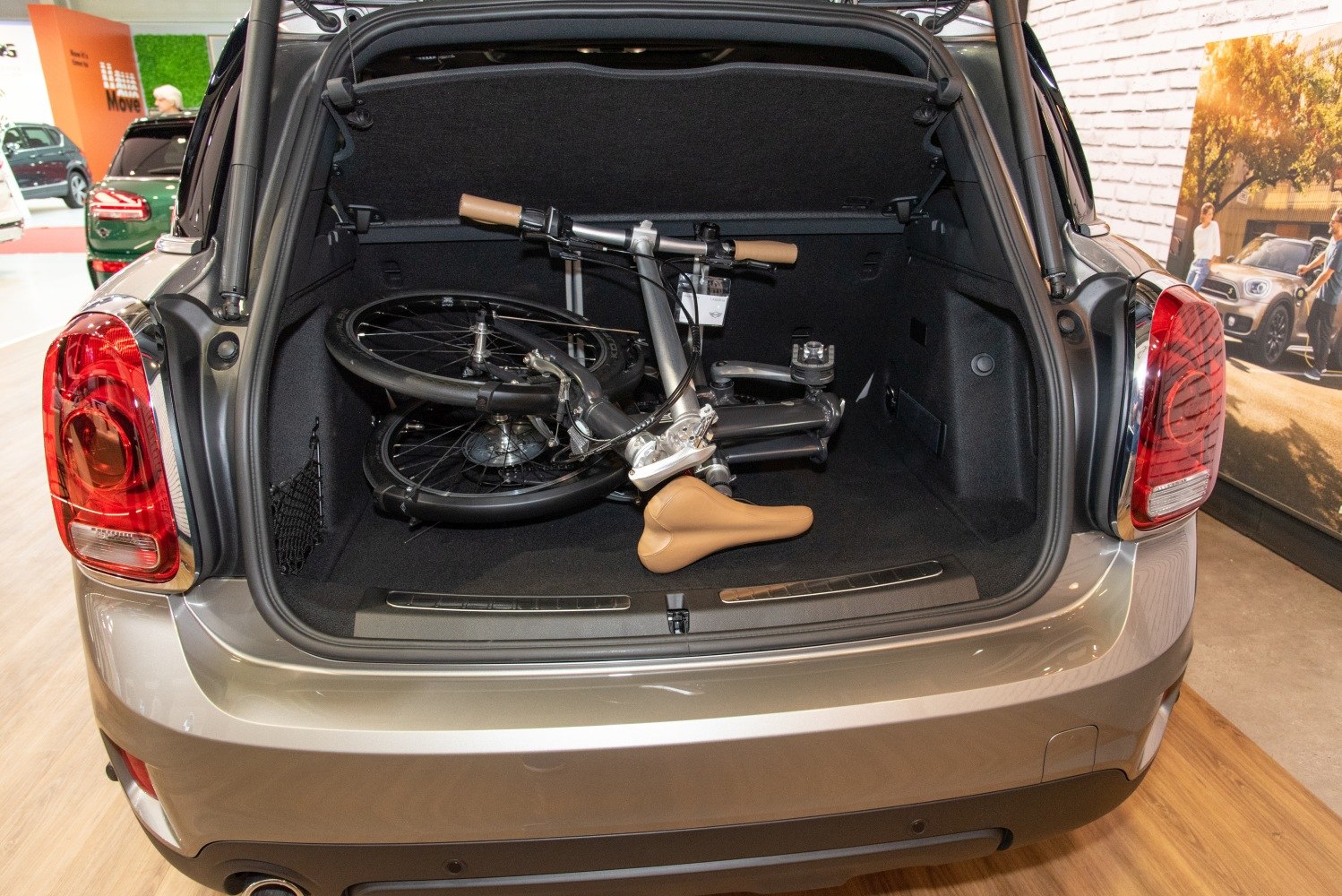 Open rear cargo space with a folded bicycle inside.