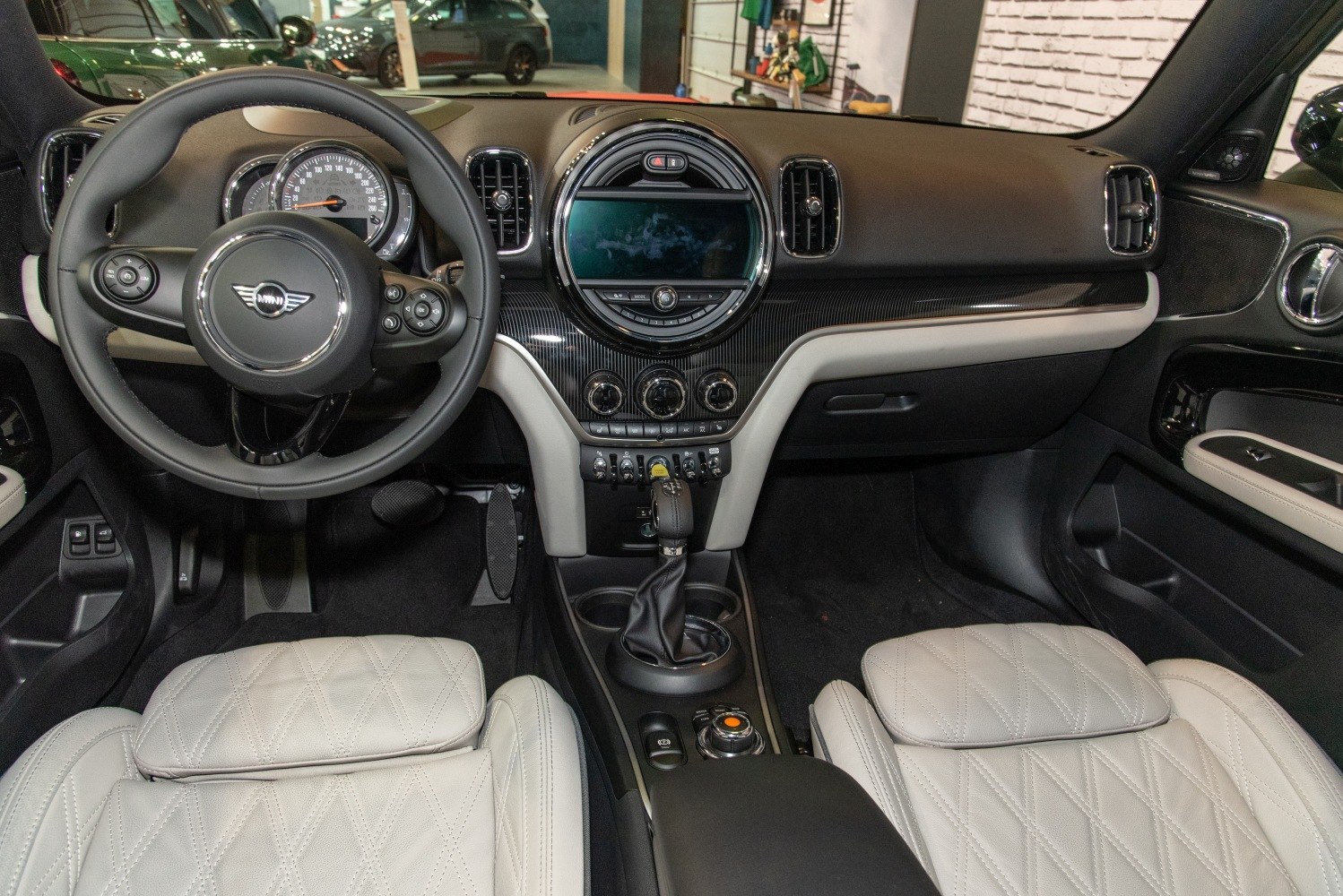 Dashboard and steering wheel with center console and quilted seats