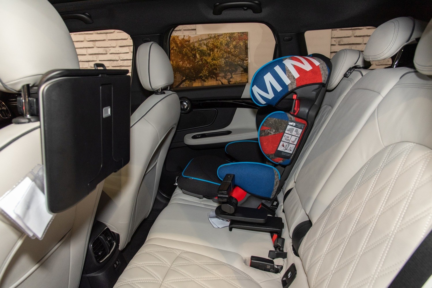 Quilted leather rear seats with branded child safety seat