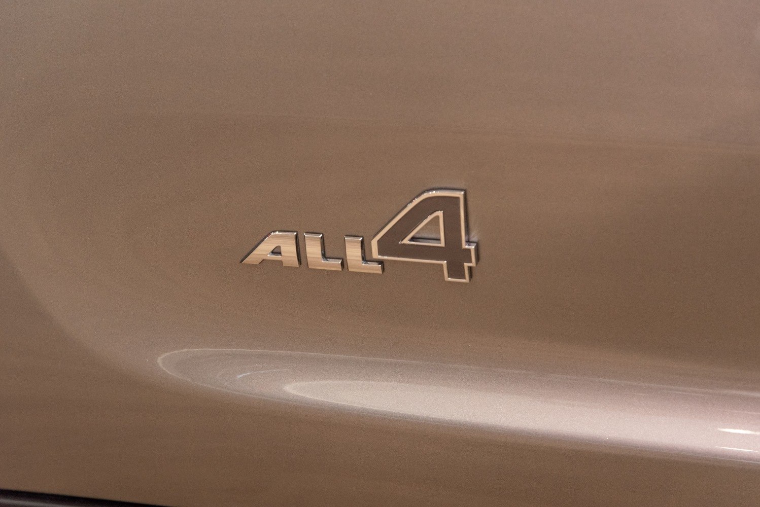 Close-up of the ALL4 AWD badge on car body