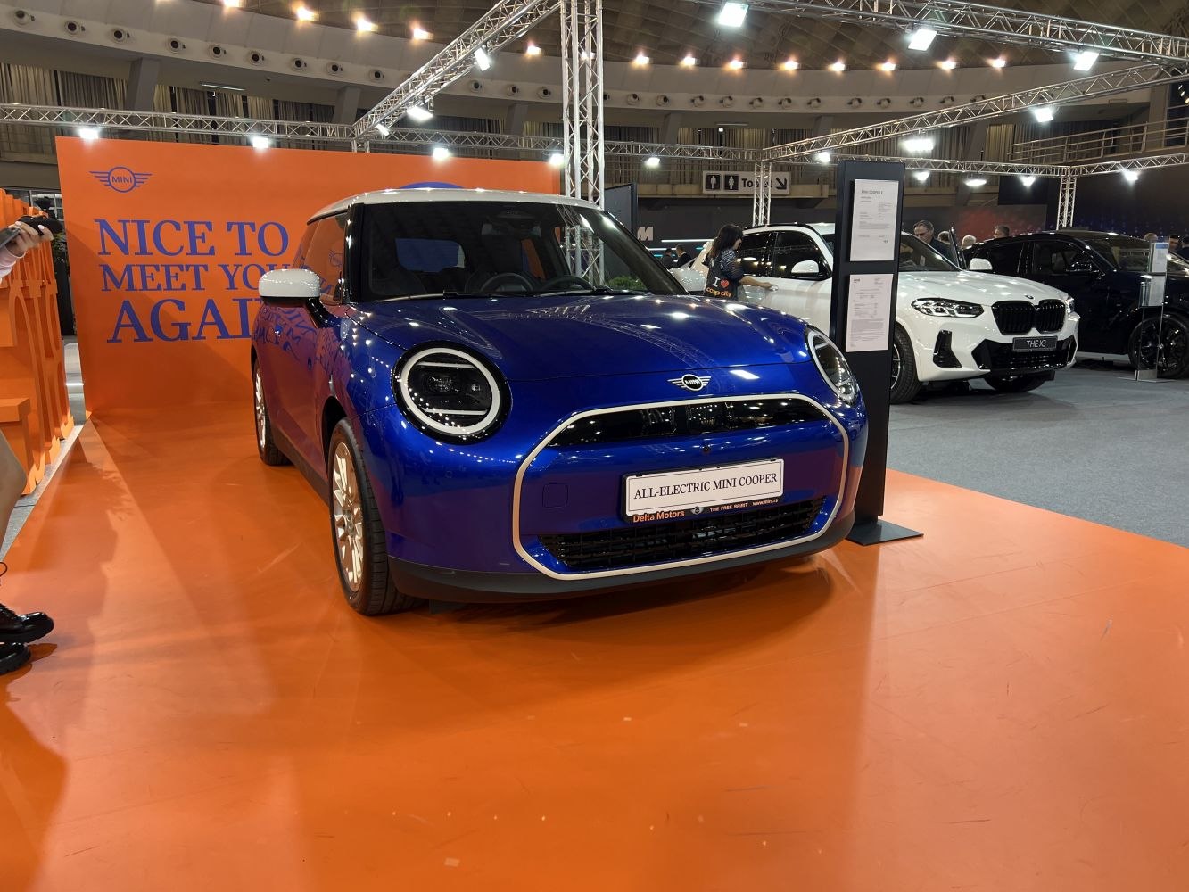 Front view with round LED headlights and sleek grille