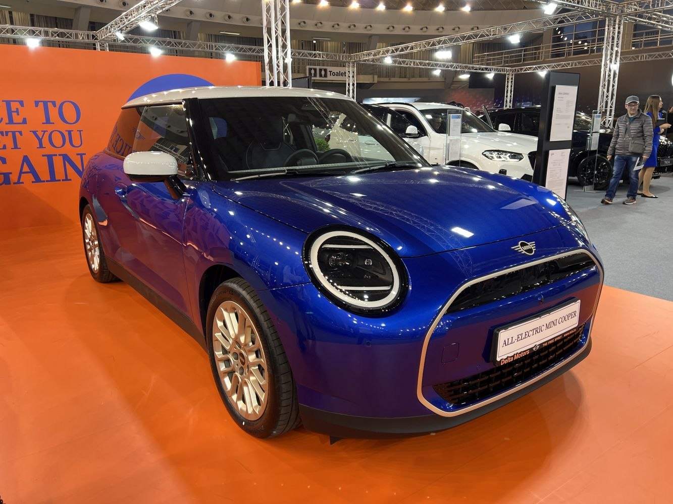 Front and side view of modern electric hatchback with unique headlights