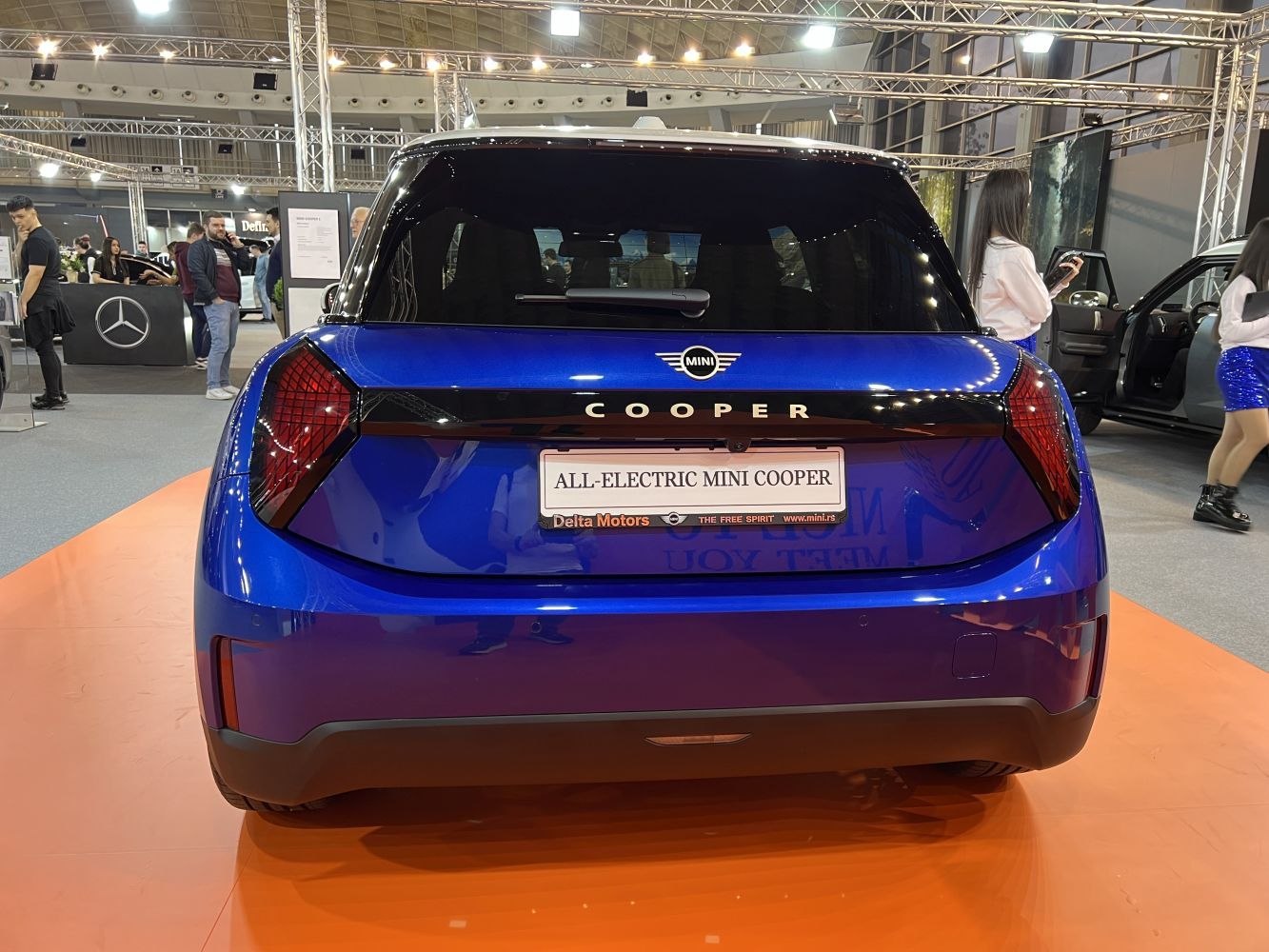 Rear view with sleek tail lights and Cooper badge on electric hatchback