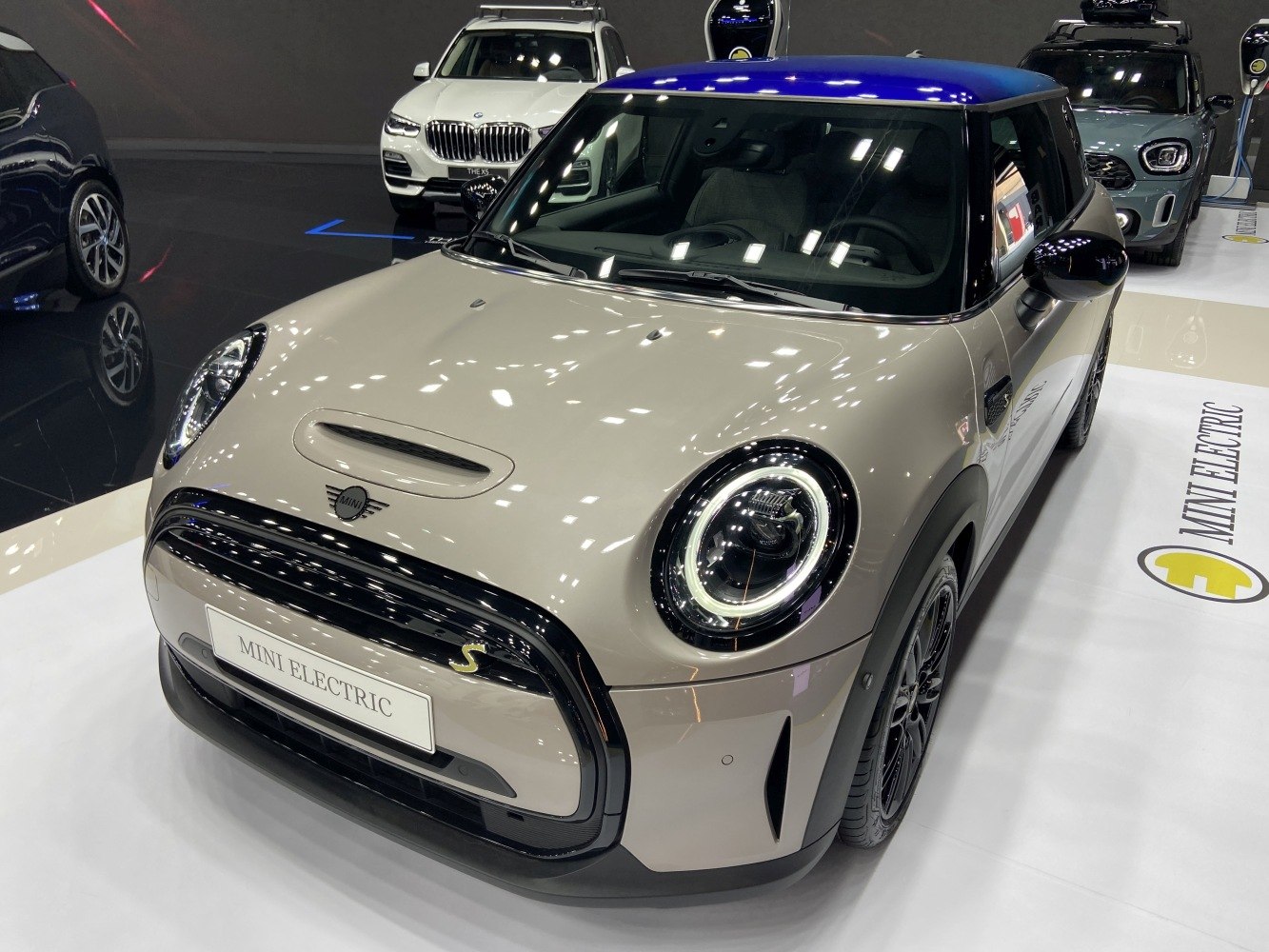 Front view with round LED headlights and black grille