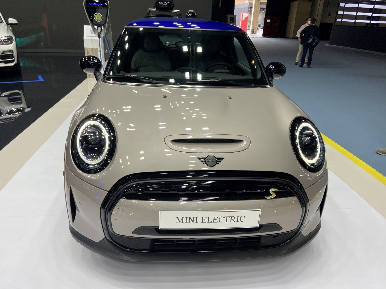 Front view with round LED headlights and unique grille design