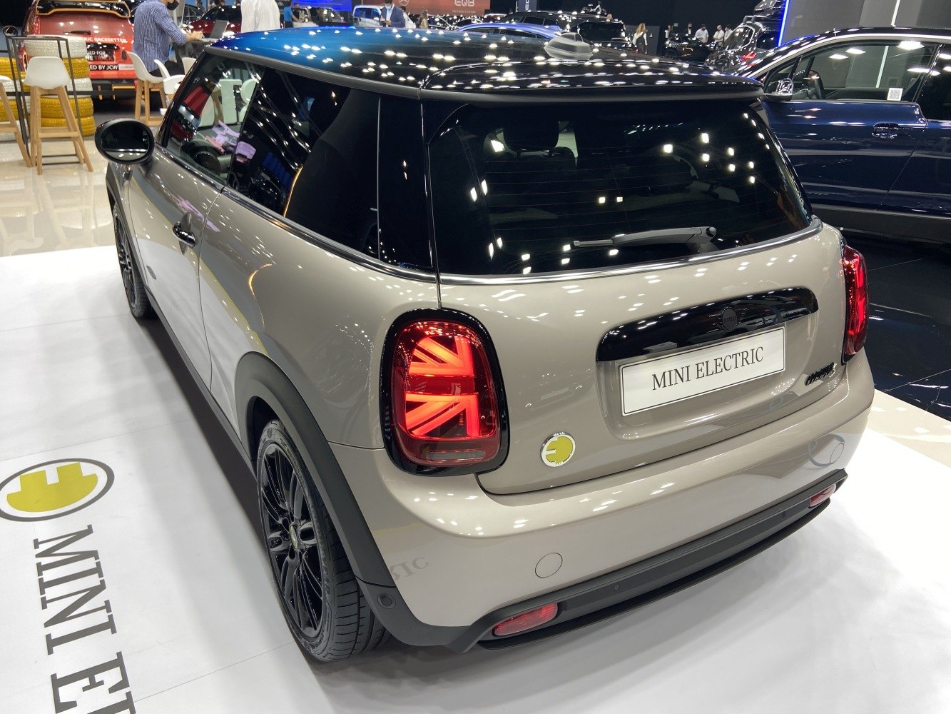 Rear view of an electric compact hatchback with Union Jack LED tail lights.