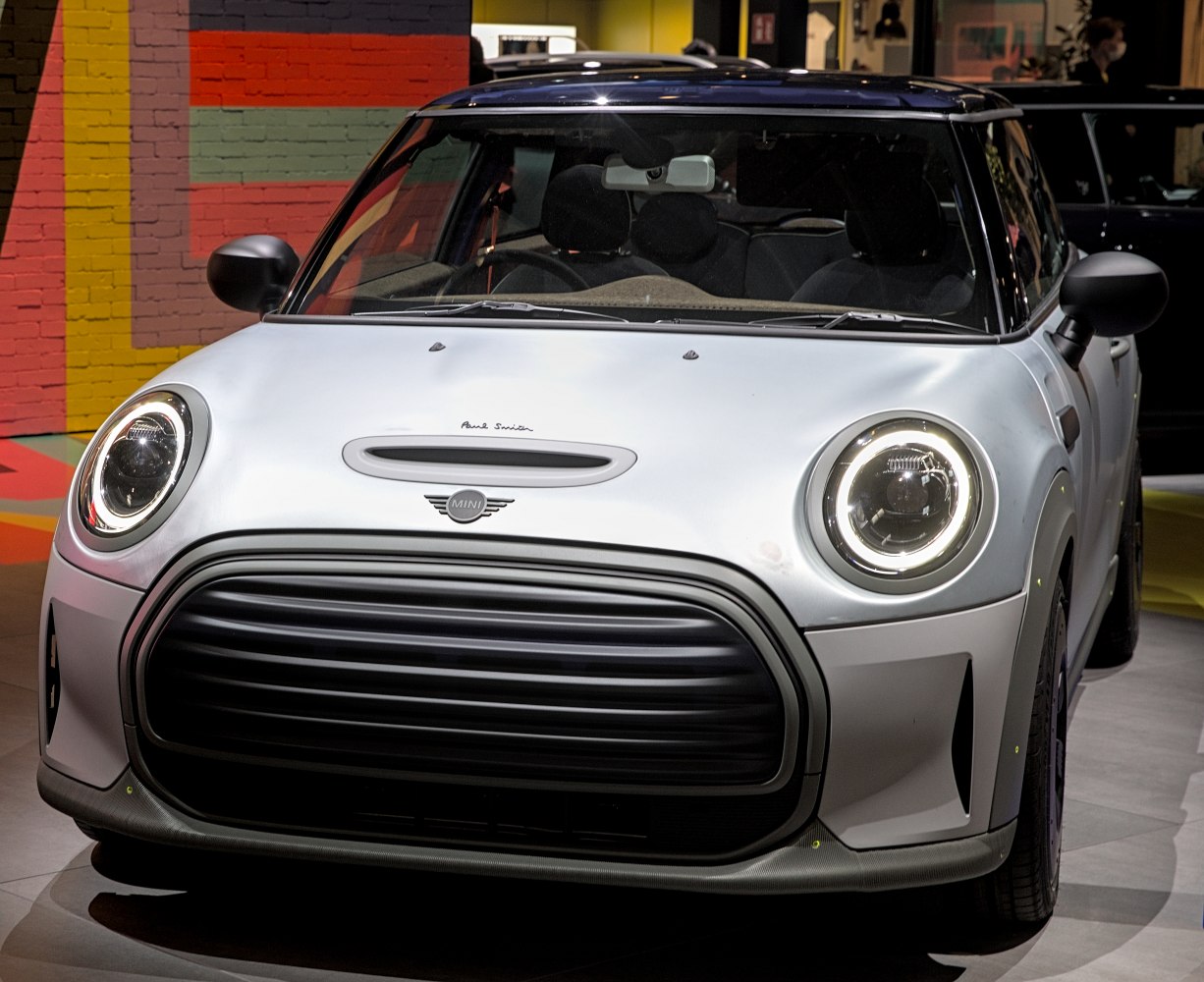 Front view with round LED headlights and unique grille