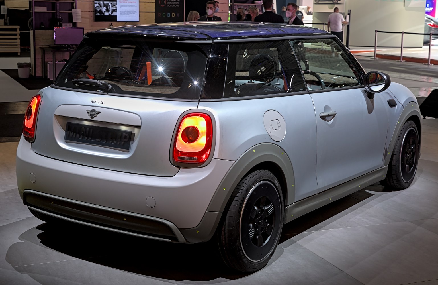 Rear view of electric hatchback with distinct tail lights and charging port