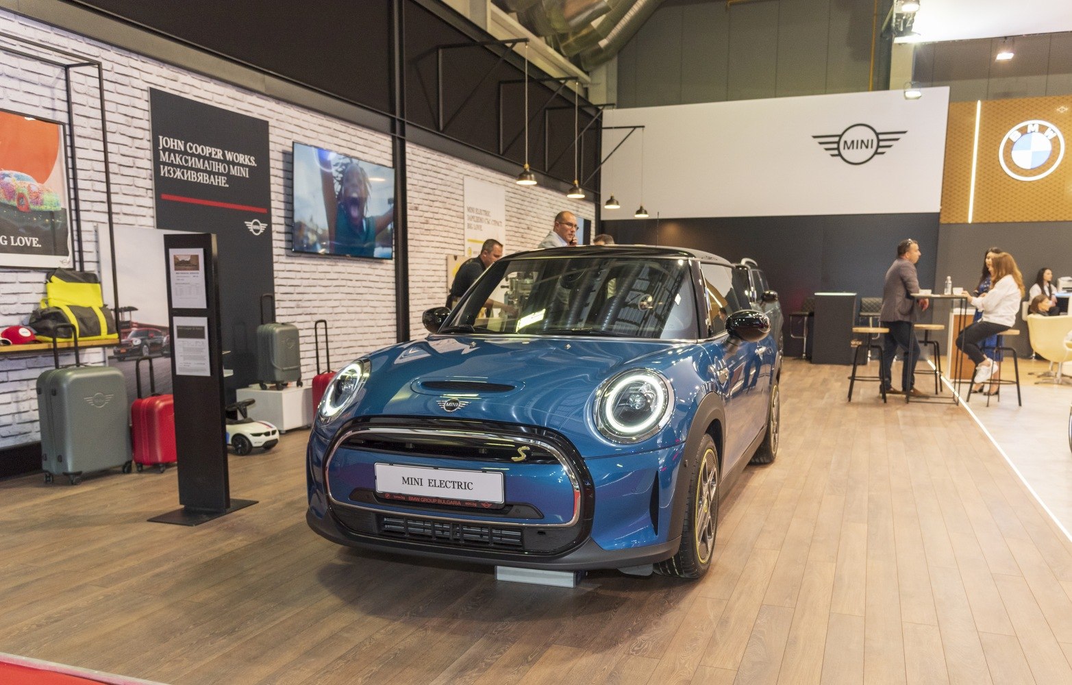 Compact electric hatchback with distinctive round LED headlights and sleek front design.