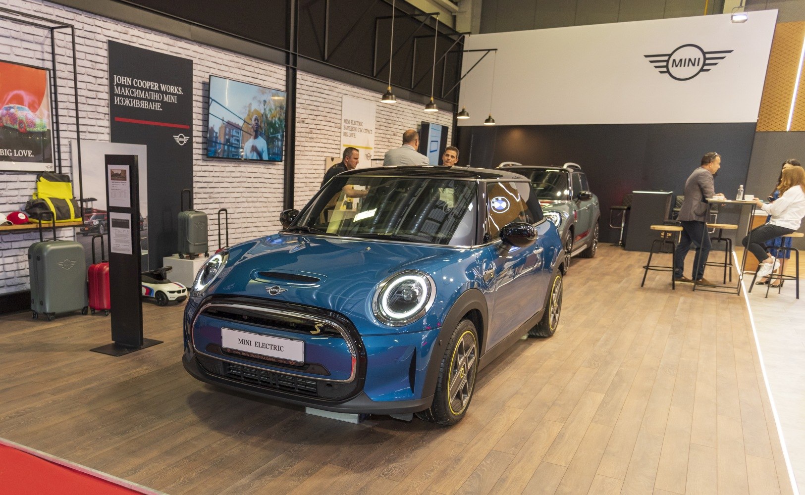Blue Mini Electric Cooper SE with LED headlights and unique wheel design