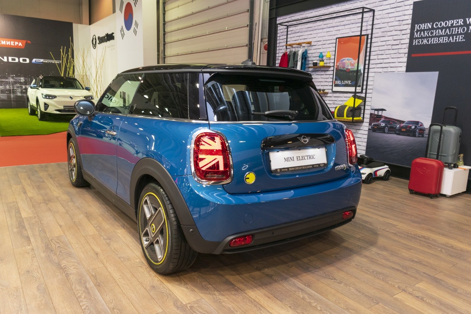 Rear view showing Union Jack LED tail lights and yellow-trimmed wheels