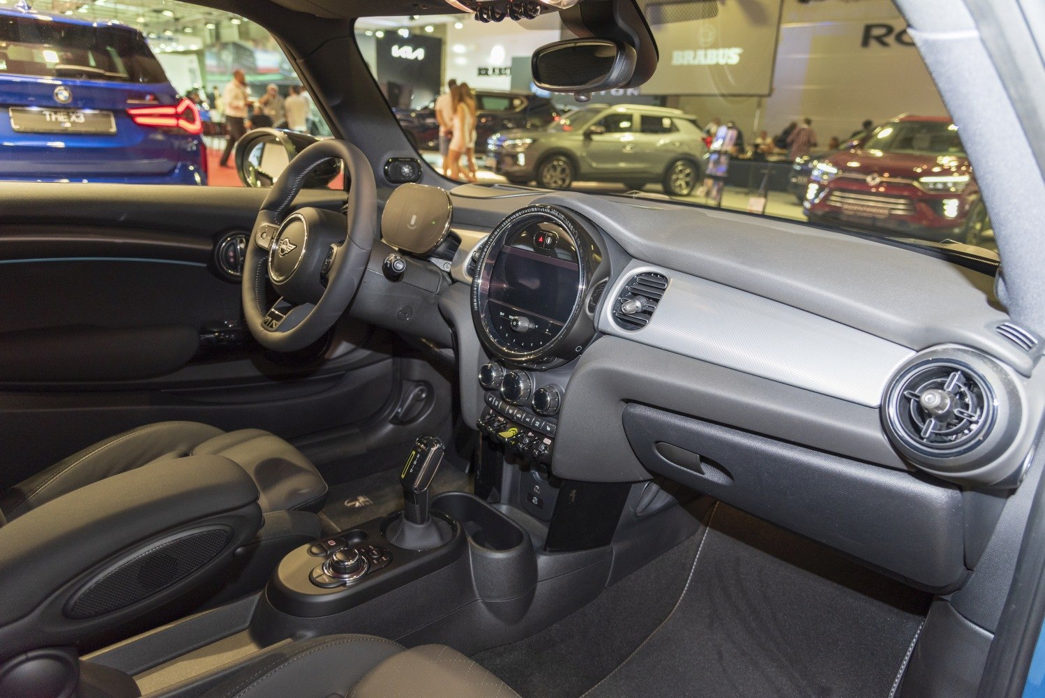 Interior dashboard and steering wheel with digital instrument cluster and infotainment display