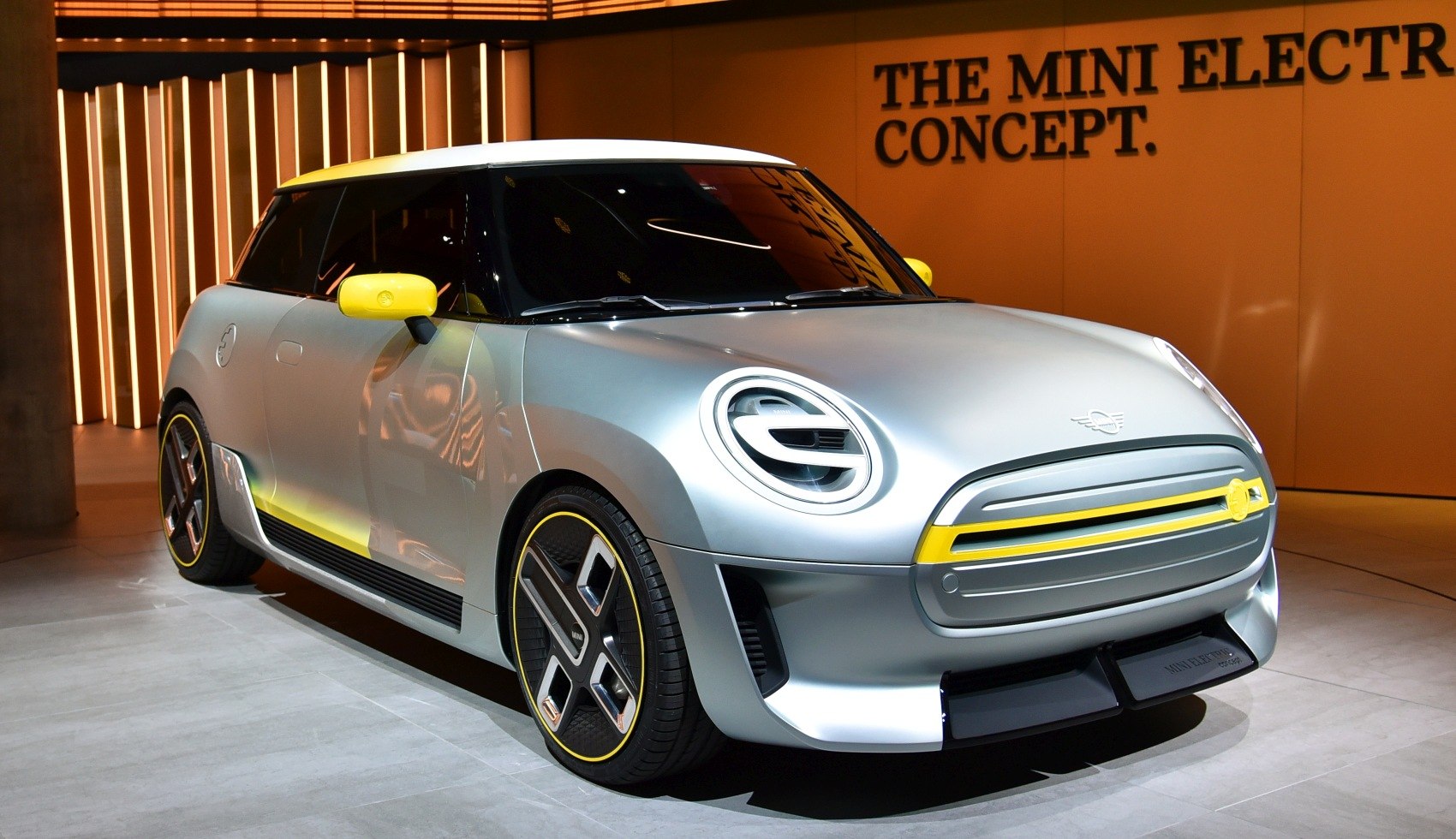 Futuristic electric hatchback with LED headlights and yellow accents
