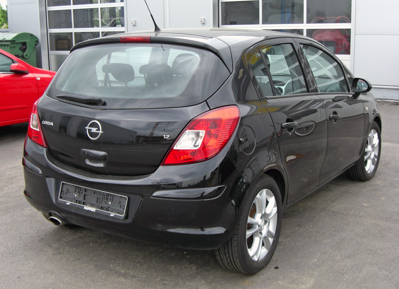 Rear view of 5-door hatchback with tail lights and alloy wheels