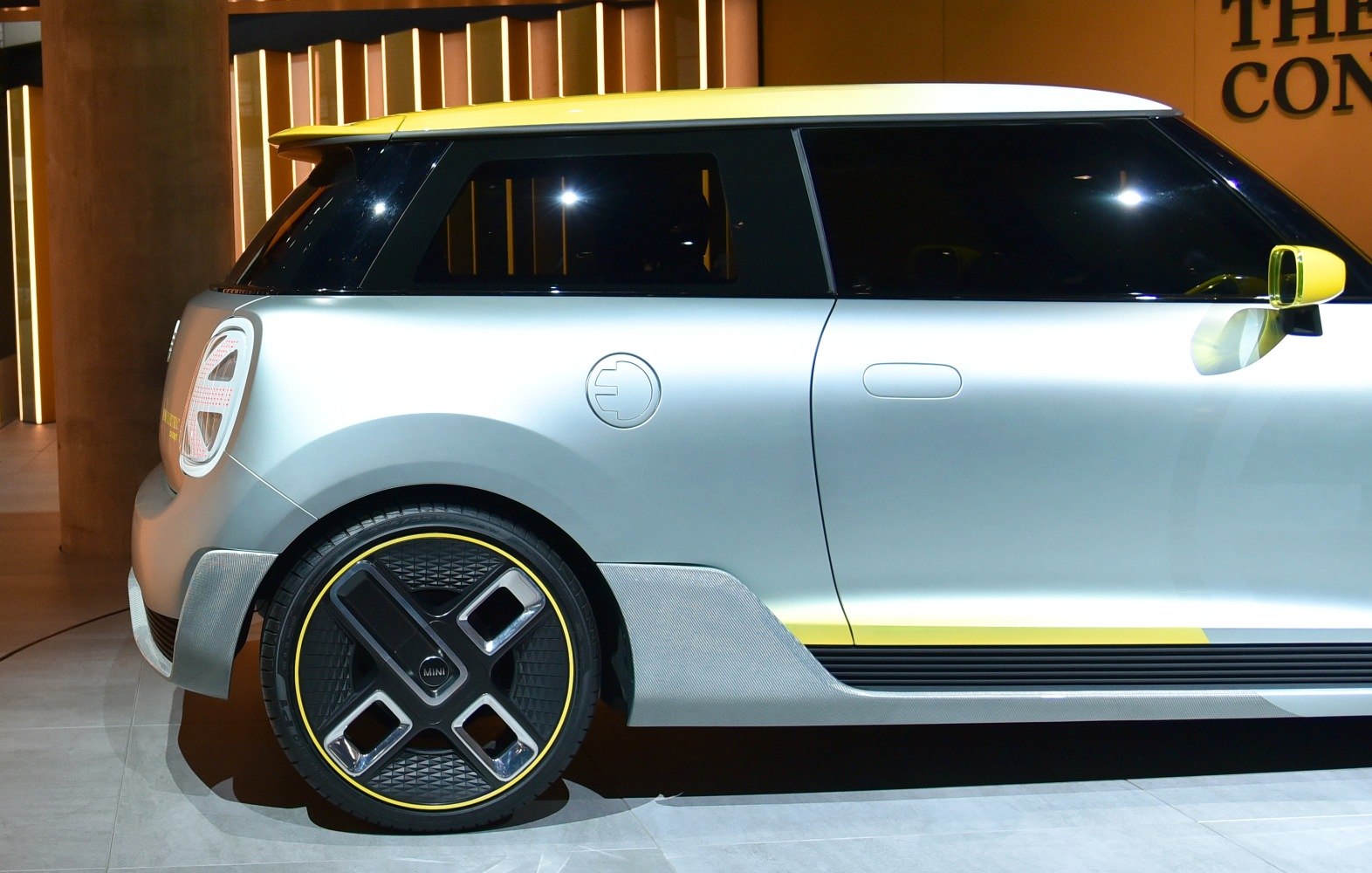 Rear side view of electric vehicle with unique wheel design and sleek bodywork