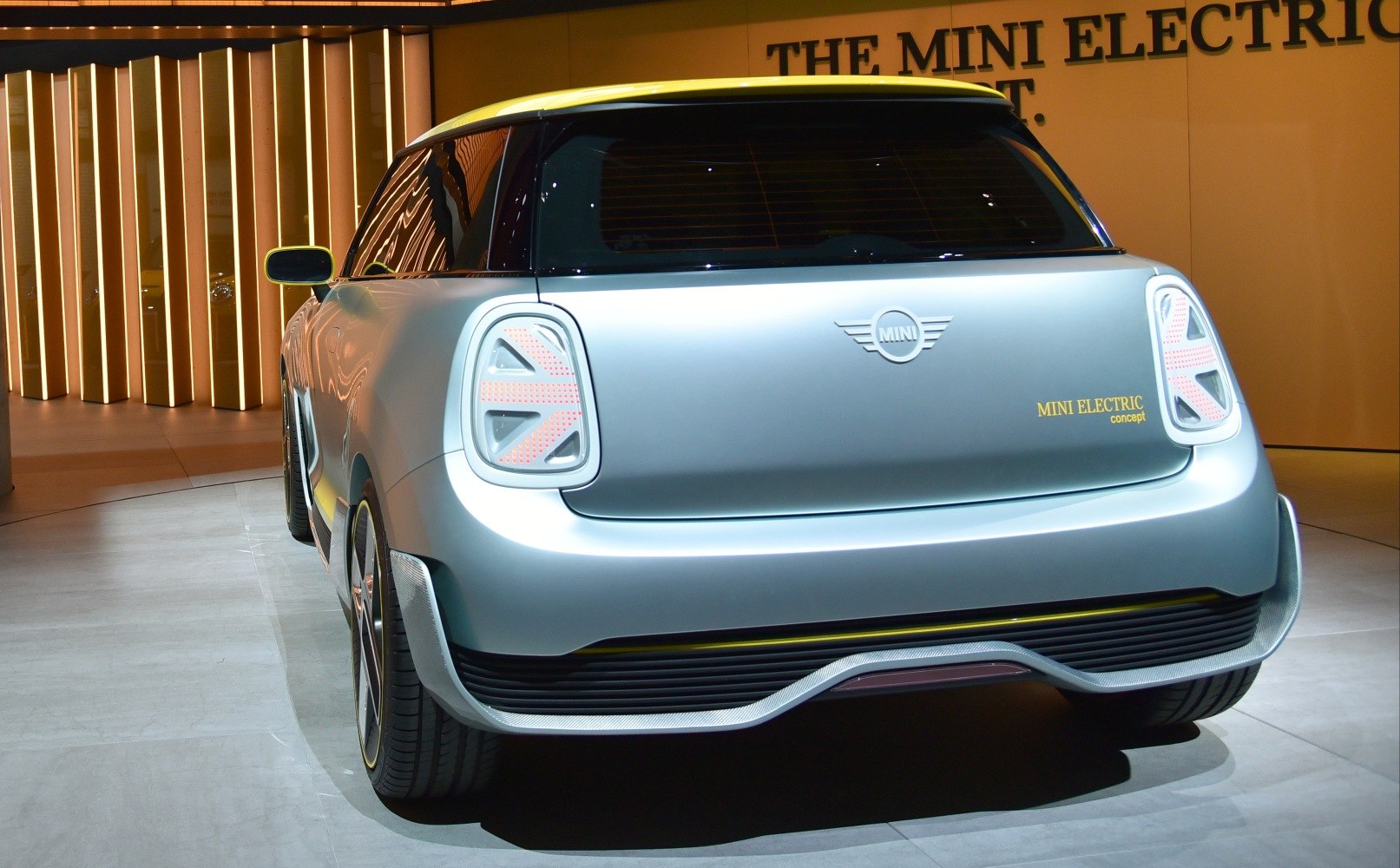 Rear view of a modern electric hatchback with distinctive taillights and a clean, futuristic design