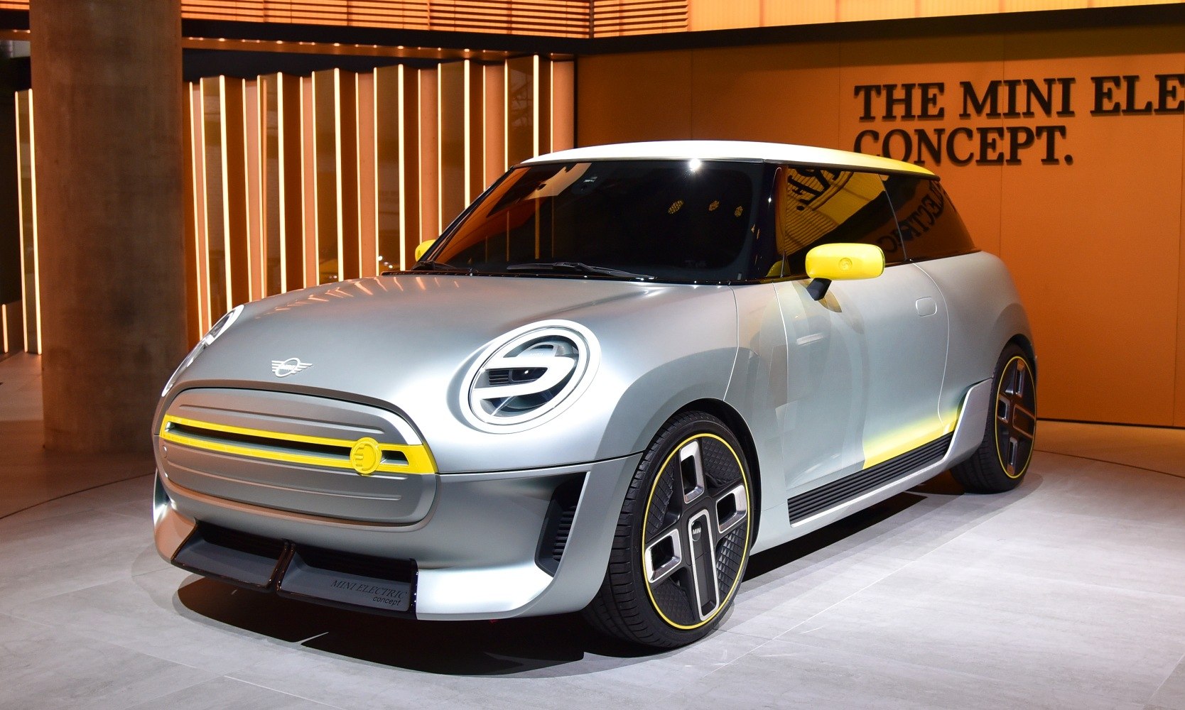 Futuristic front-end design with circular headlights and aerodynamic wheels.