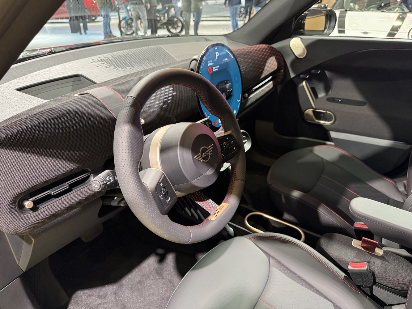 High-tech steering wheel with circular digital display in car interior