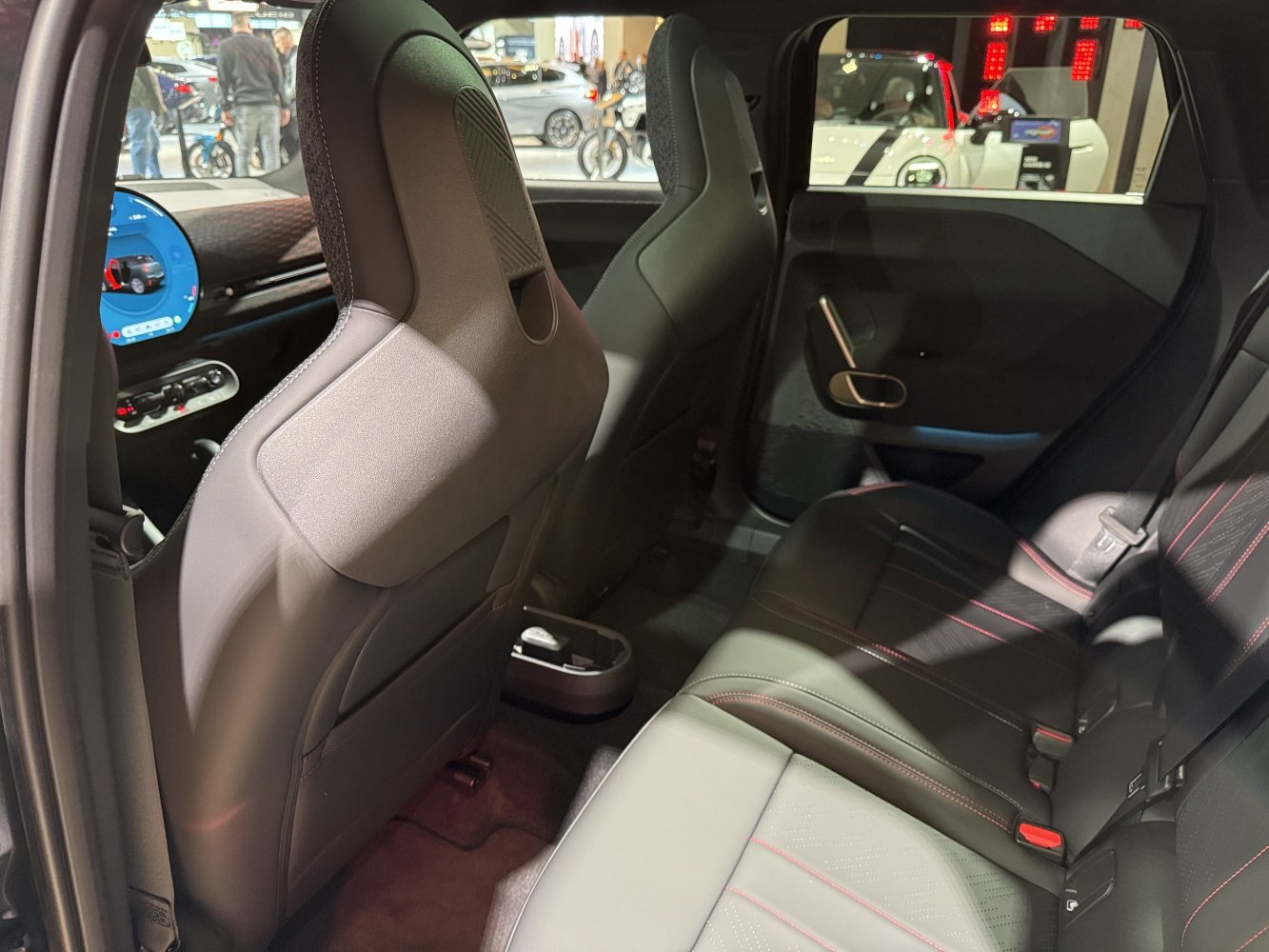 Rear interior with sporty front seats and leather back seats.
